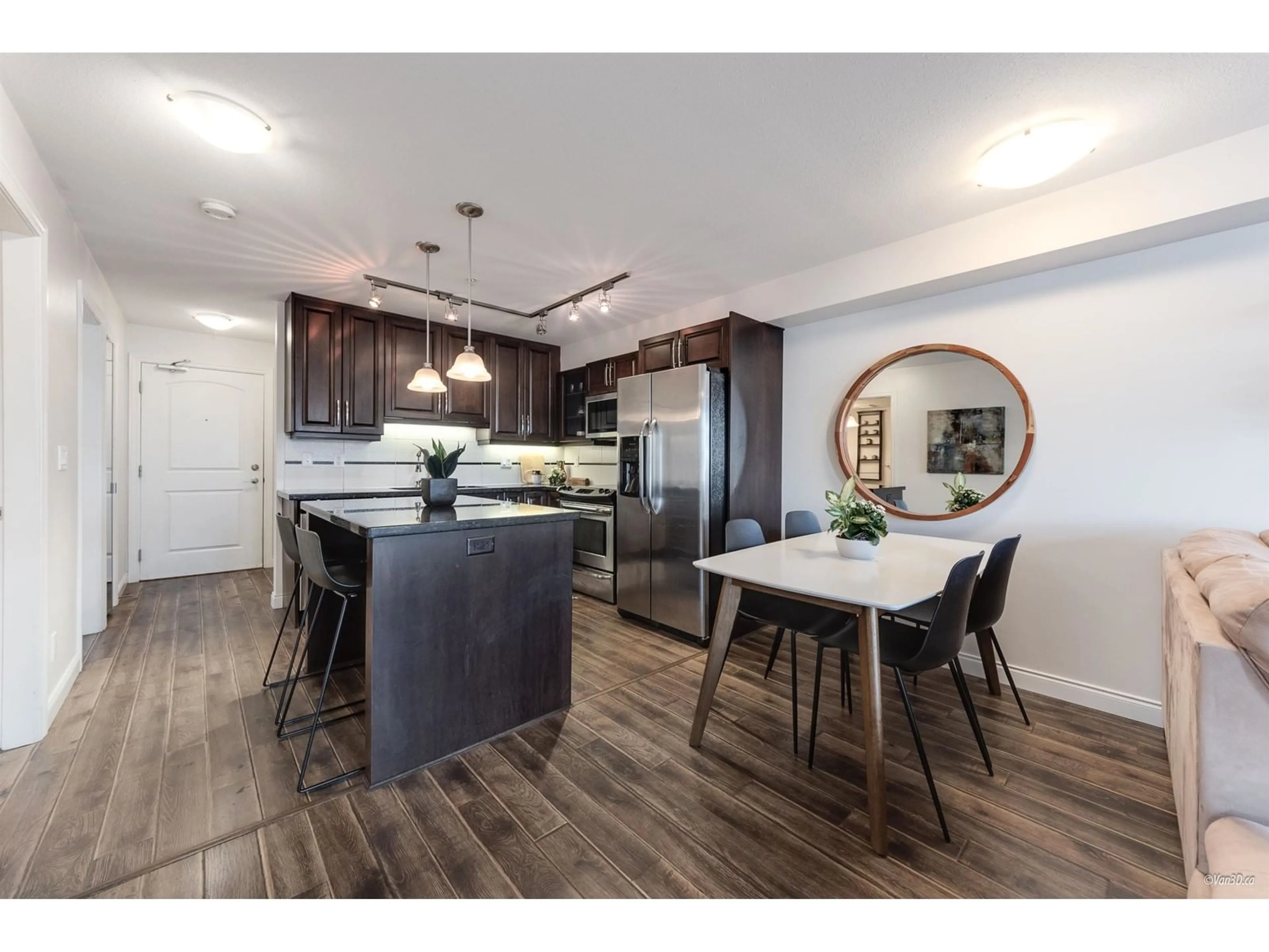 Open concept kitchen, wood/laminate floor for 211 - 19939 55A, Langley British Columbia V3A3X4