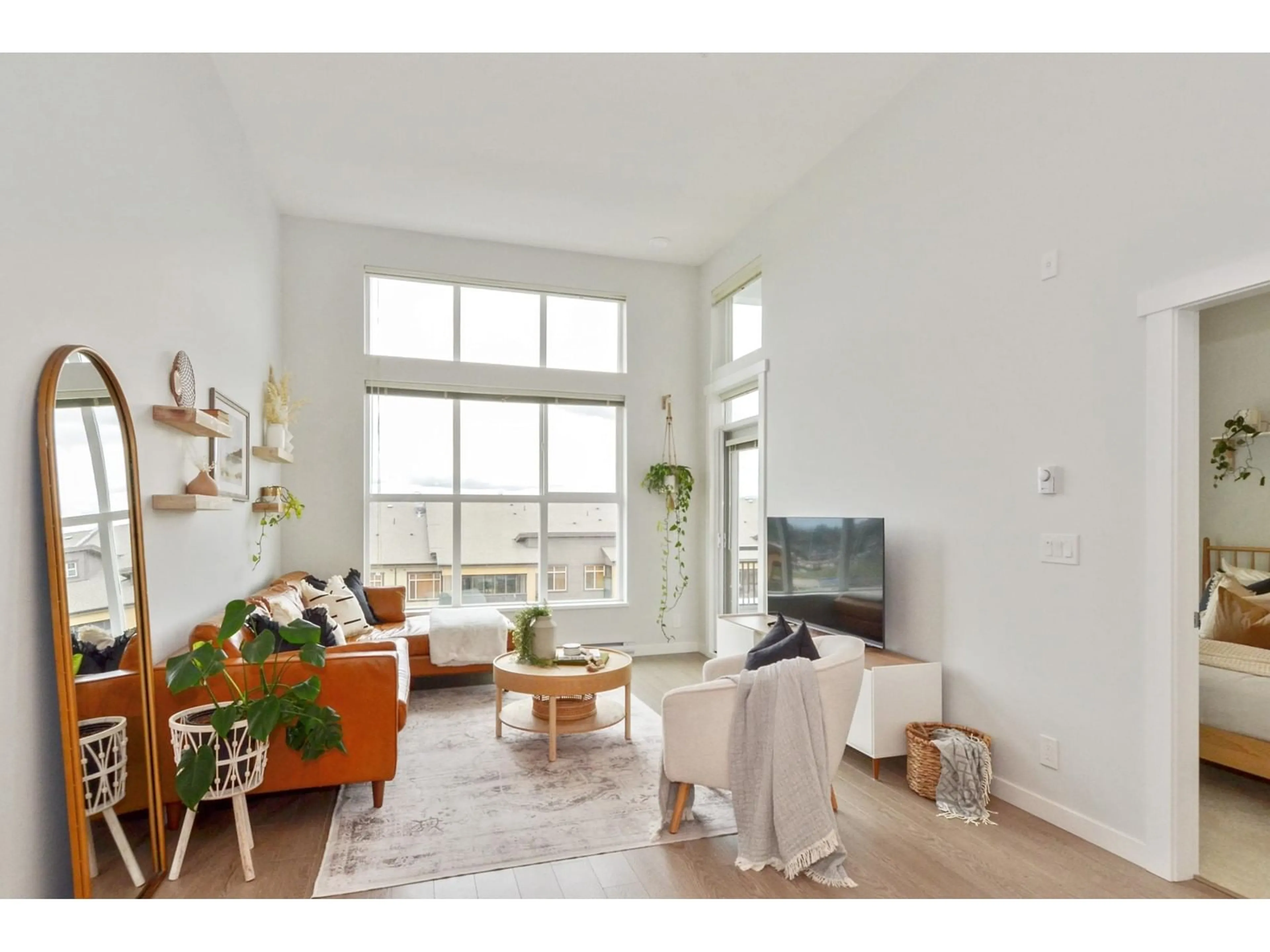 Living room with furniture, wood/laminate floor for B606 - 8150 207, Langley British Columbia V2Y4J3