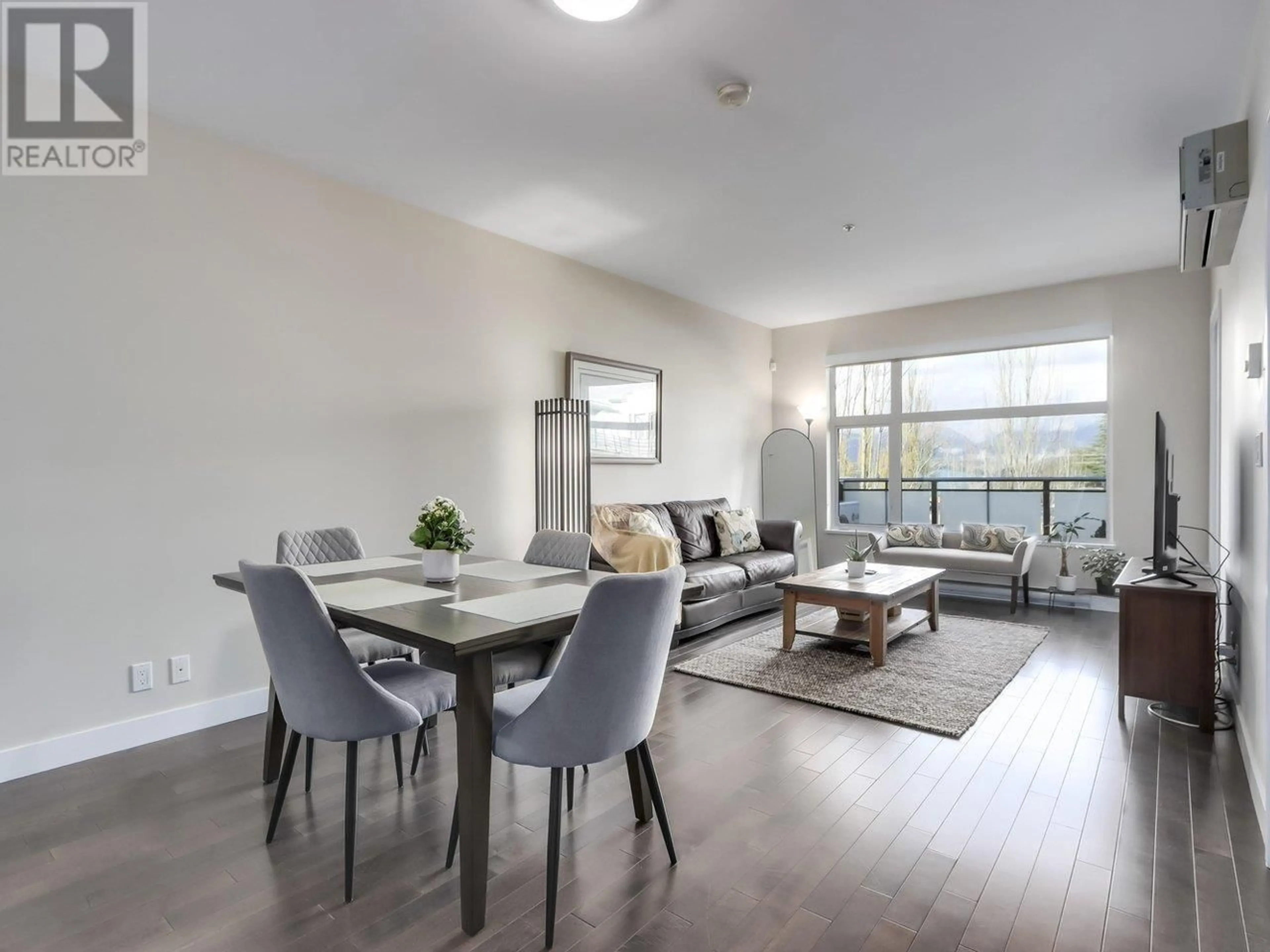 Living room with furniture, wood/laminate floor for 301 4570 HASTINGS STREET, Burnaby British Columbia V5C0E8