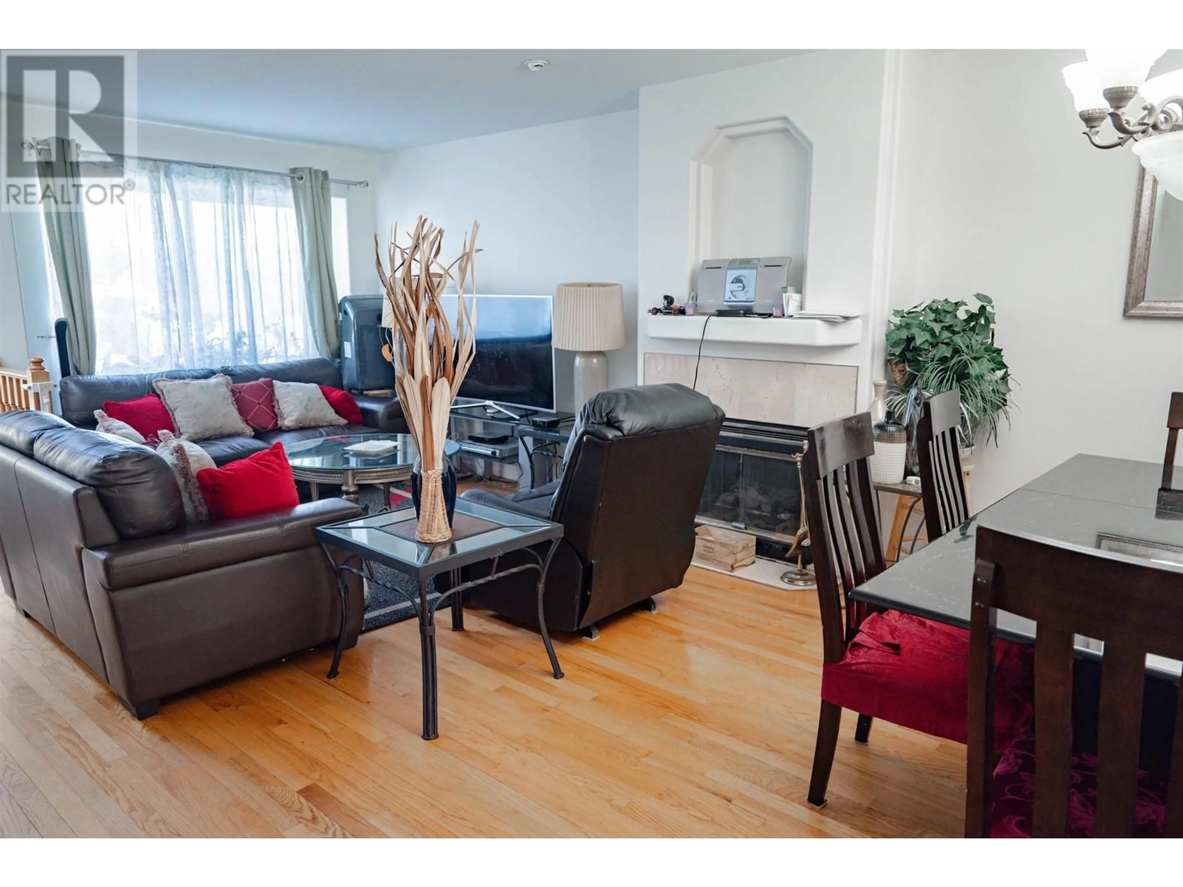 Living room with furniture, wood/laminate floor for 7936 EDMONDS STREET, Burnaby British Columbia V3N1C2