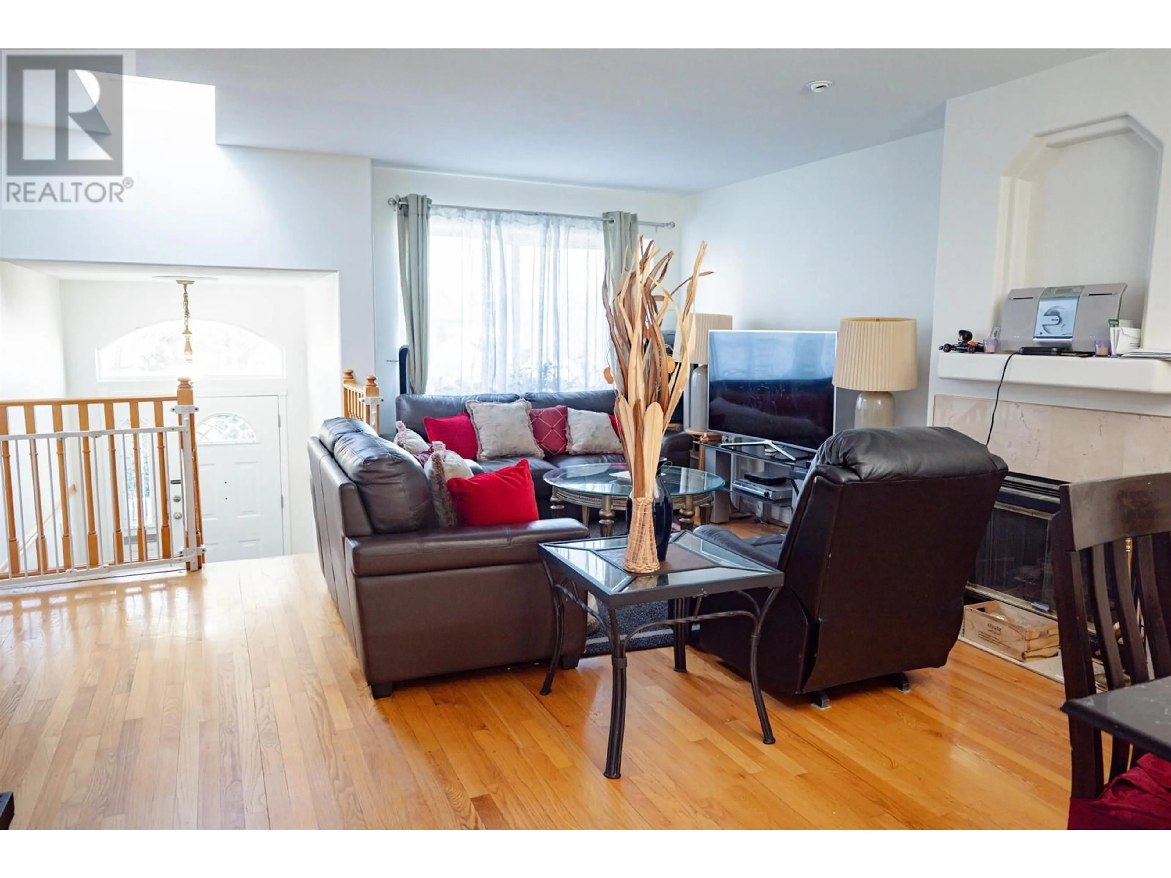 Living room with furniture, wood/laminate floor for 7936 EDMONDS STREET, Burnaby British Columbia V3N1C2