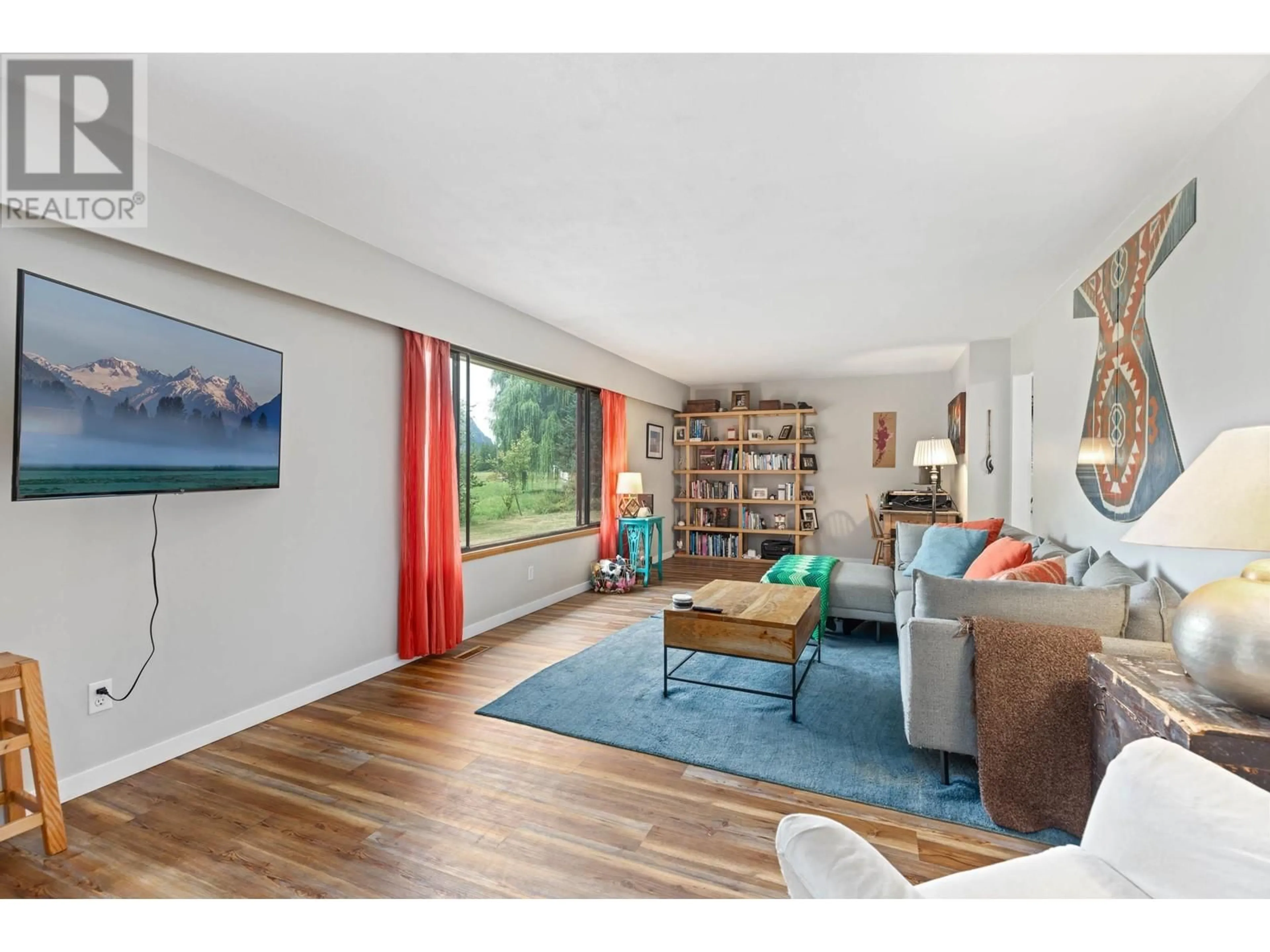 Living room with furniture, wood/laminate floor for 8988B PEMBERTON MEADOWS ROAD, Pemberton British Columbia V0N2L2