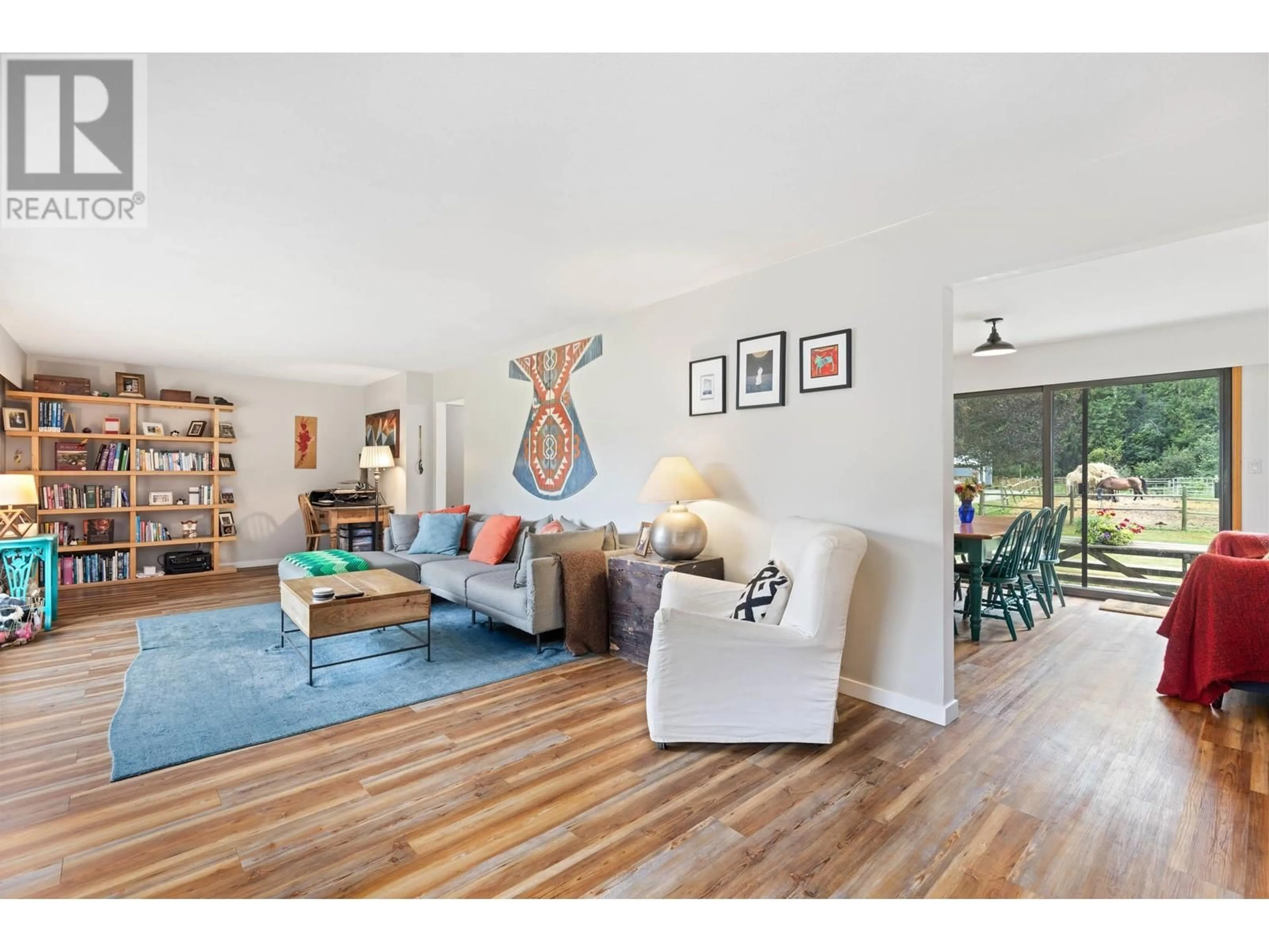 Living room with furniture, wood/laminate floor for 8988B PEMBERTON MEADOWS ROAD, Pemberton British Columbia V0N2L2