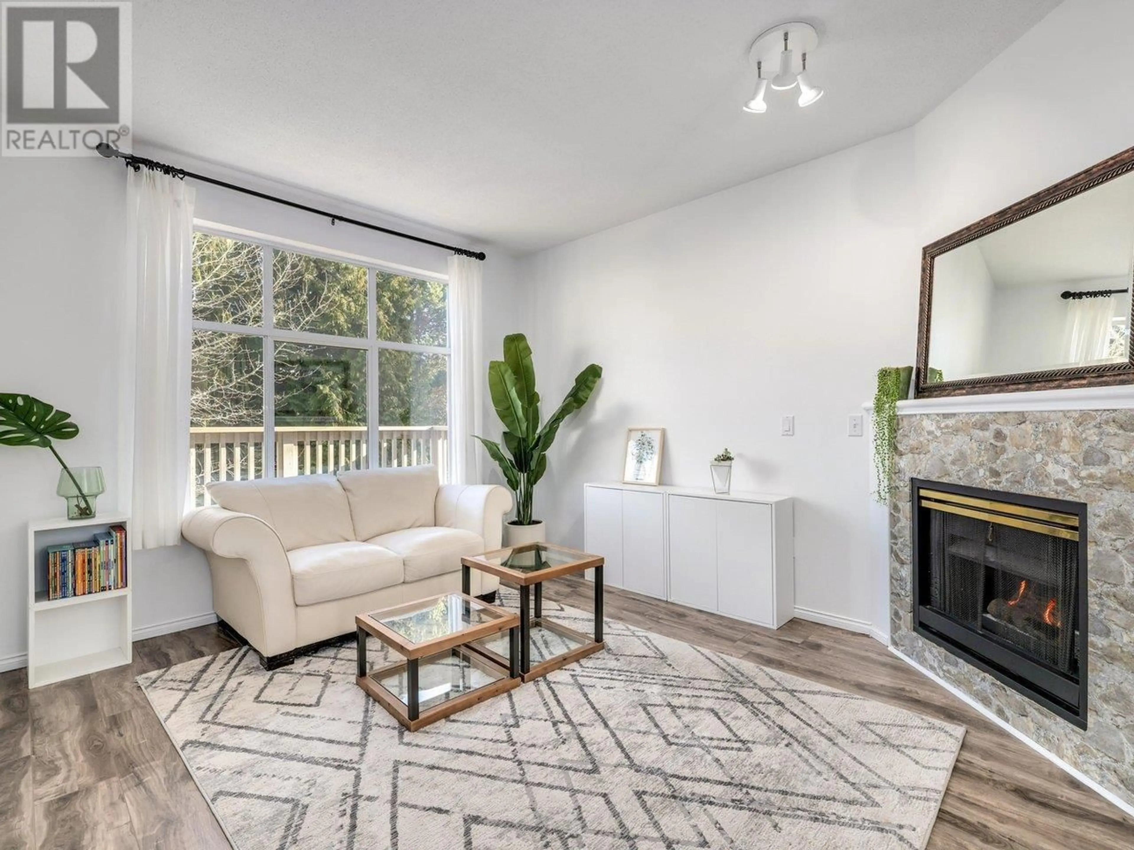 Living room with furniture, wood/laminate floor for 74 6588 BARNARD DRIVE, Richmond British Columbia V7C5R8