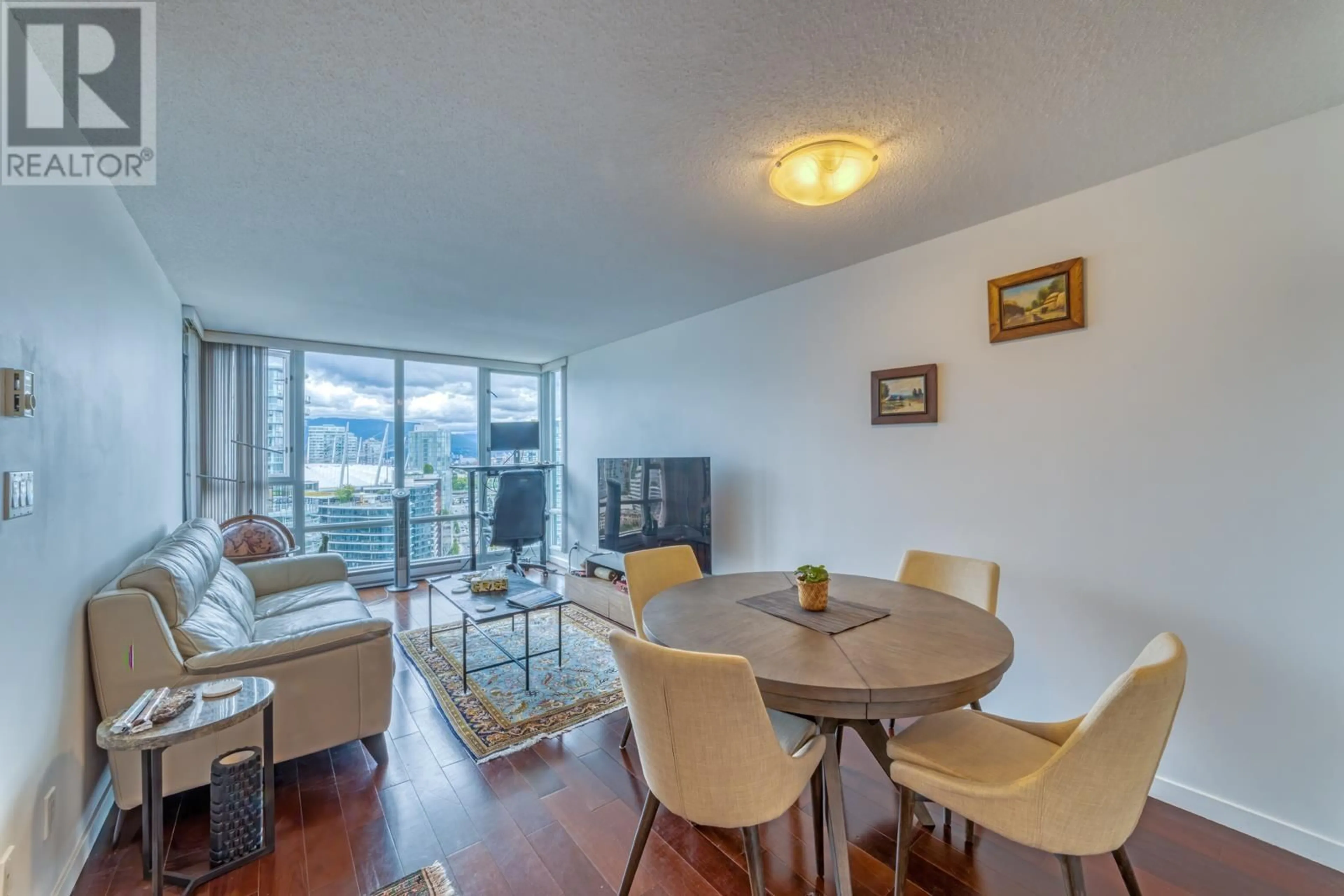 Living room with furniture, wood/laminate floor for 2902 1033 MARINASIDE CRESCENT, Vancouver British Columbia V6Z3A3