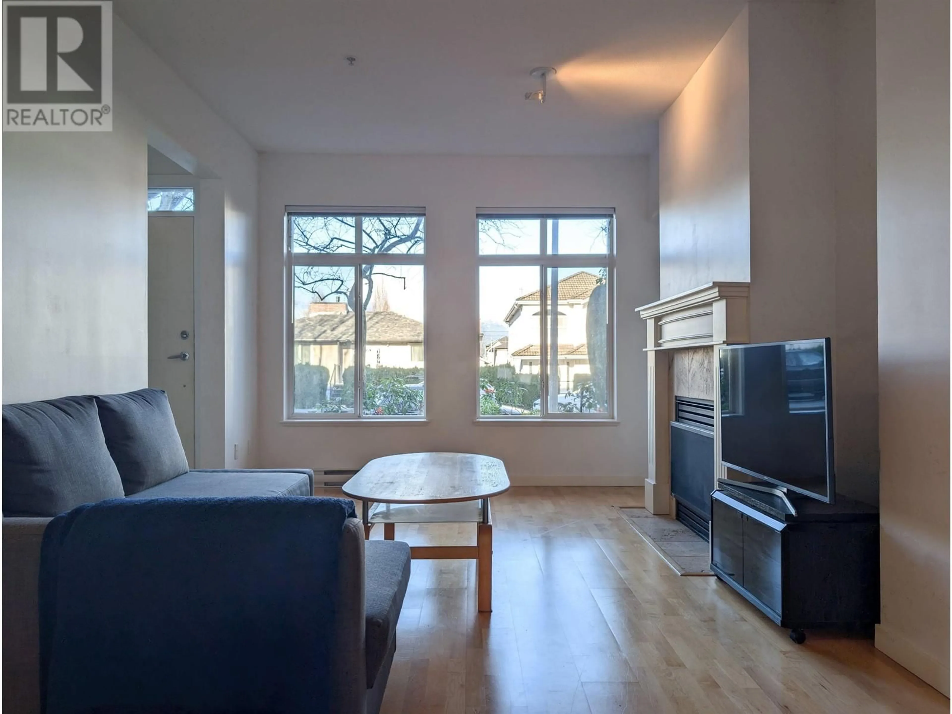 Living room with furniture, wood/laminate floor for 104 4238 ALBERT STREET, Burnaby British Columbia V5C6T1