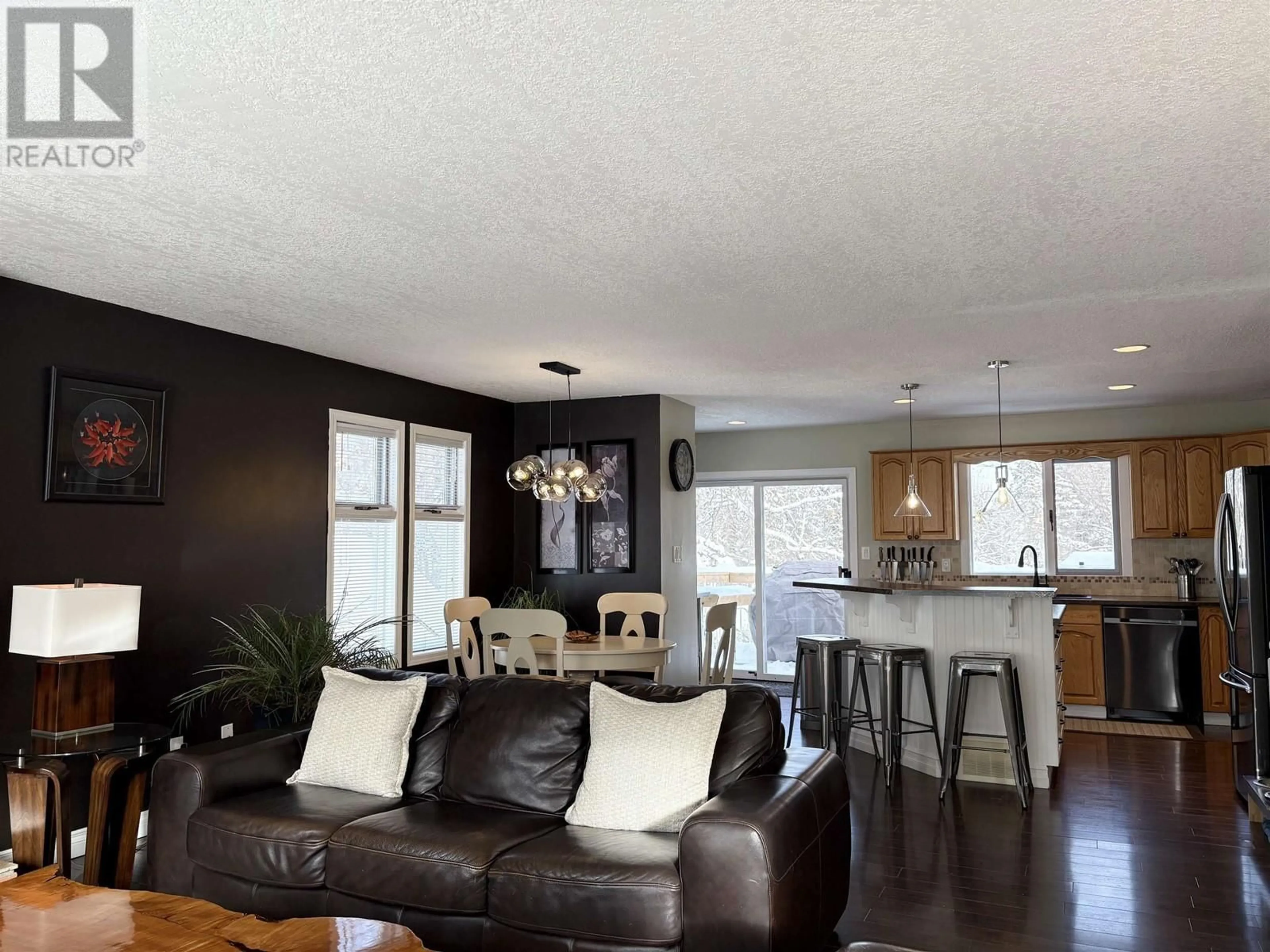 Living room with furniture, wood/laminate floor for 3182 WALLACE CRESCENT, Prince George British Columbia V2K3R6