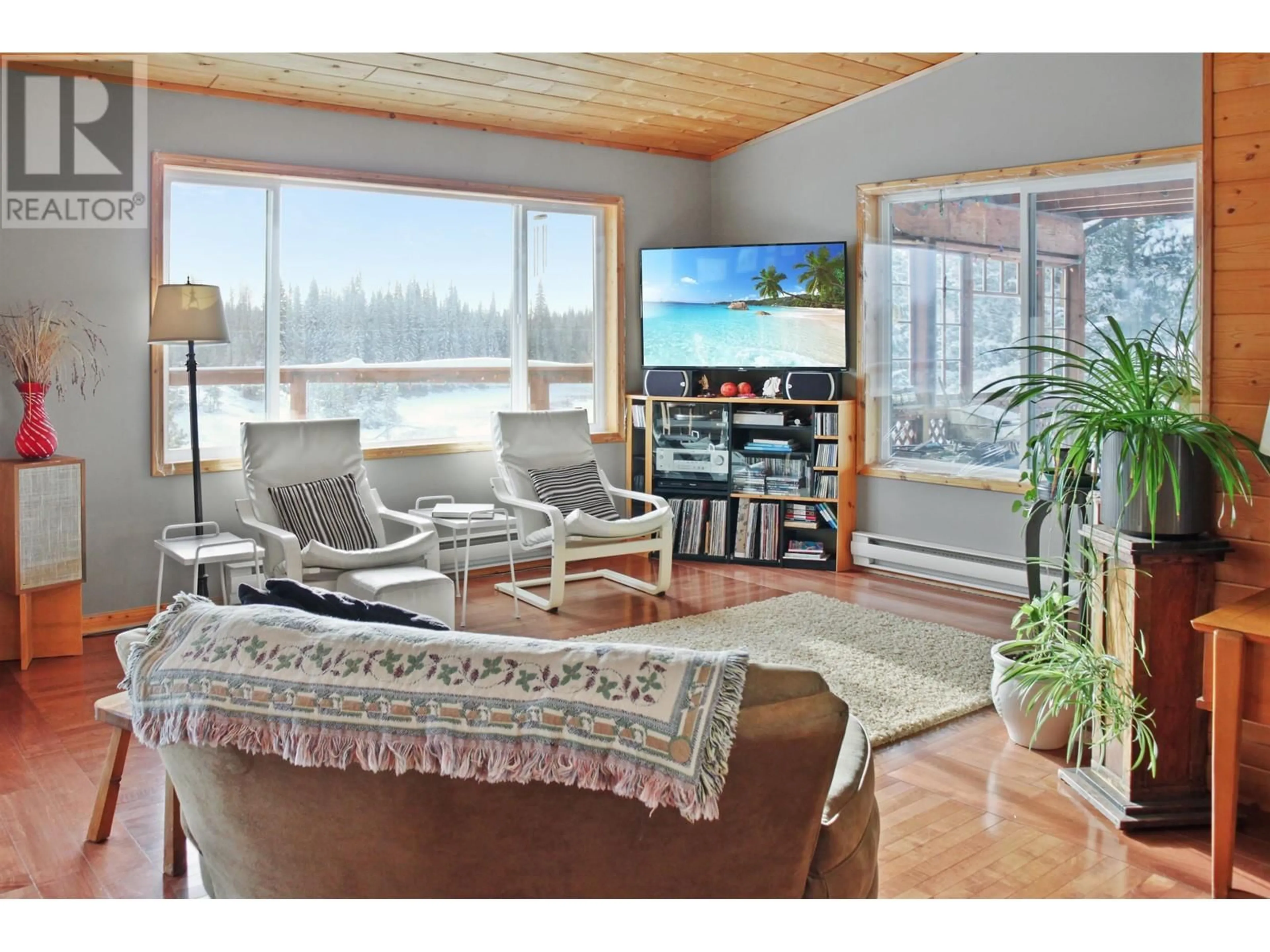 Living room with furniture, wood/laminate floor for 7541 E SHERIDAN LAKE ROAD, Sheridan Lake British Columbia V0K1X2