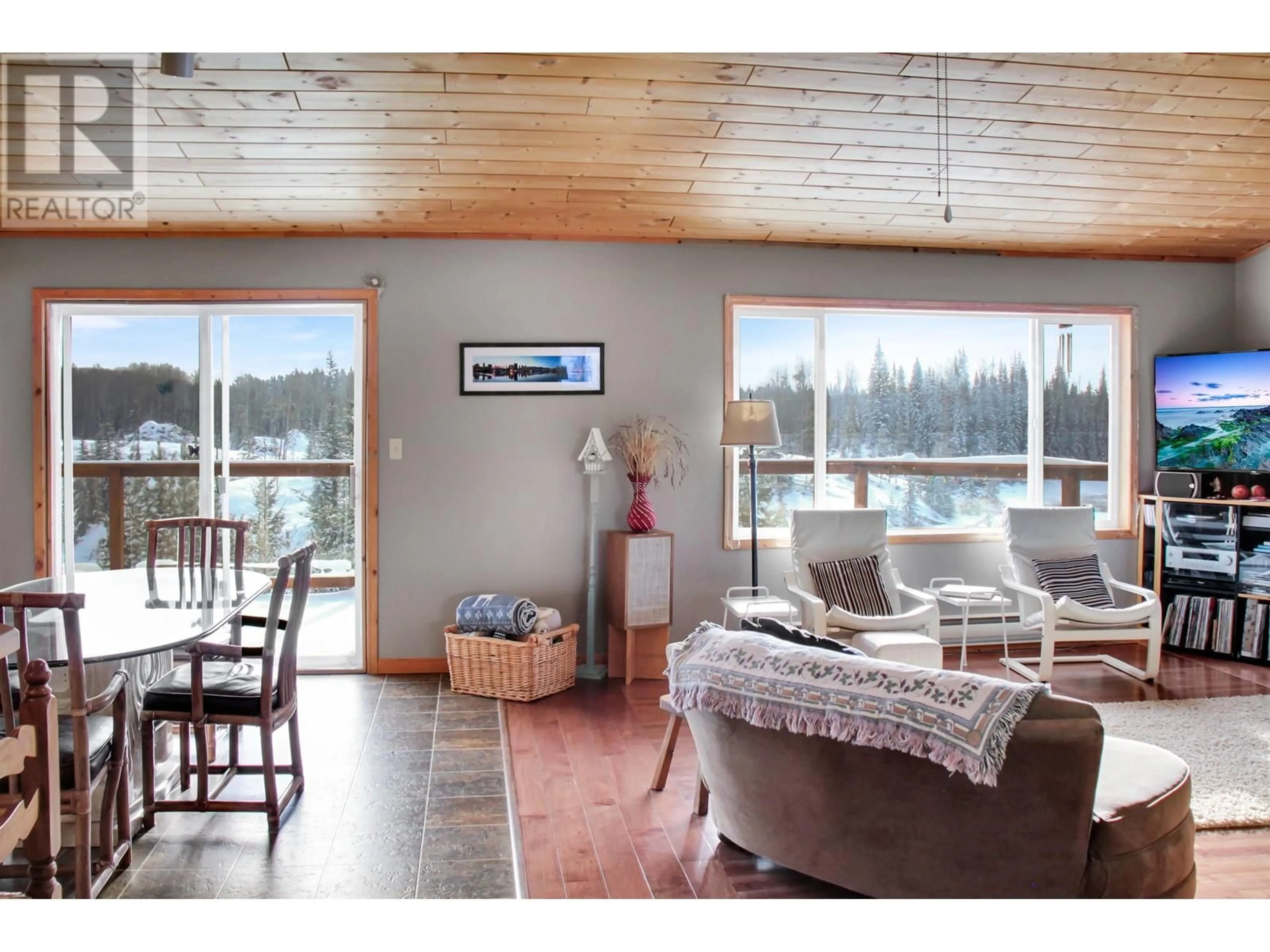 Living room with furniture, wood/laminate floor for 7541 E SHERIDAN LAKE ROAD, Sheridan Lake British Columbia V0K1X2