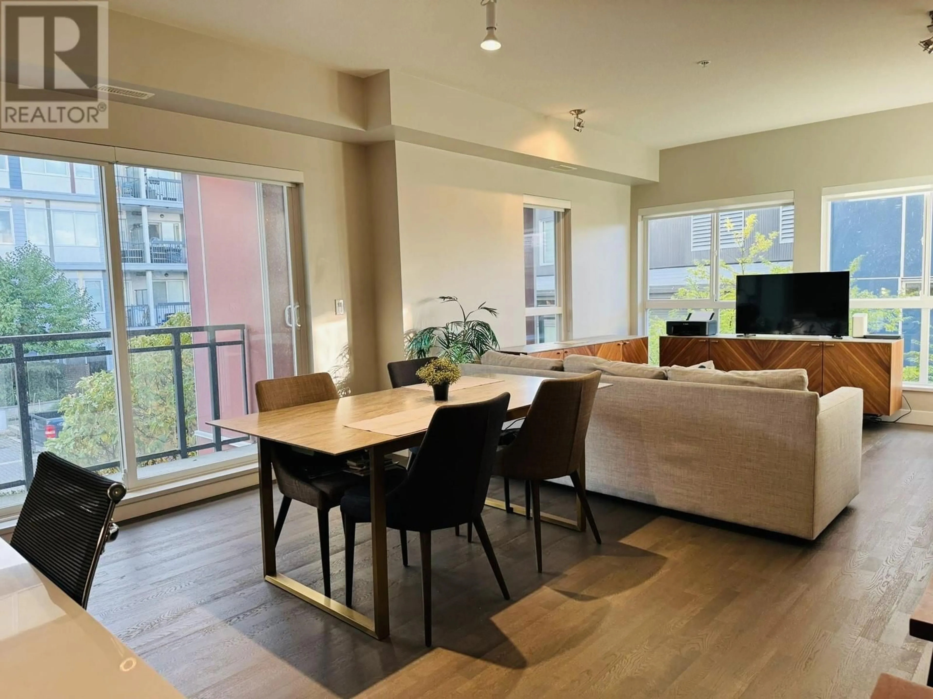 Living room with furniture, wood/laminate floor for 206 - 10033 RIVER DRIVE, Richmond British Columbia V6X0L1