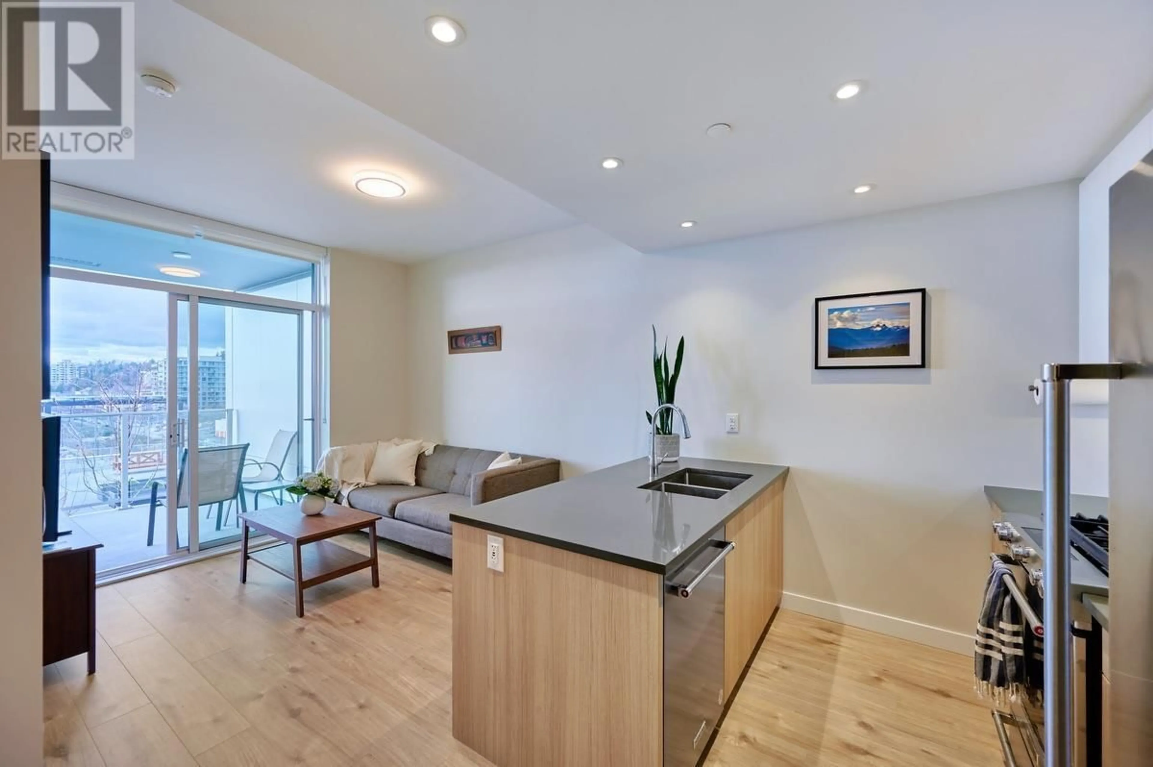 Open concept kitchen, wood/laminate floor for 703 - 3430 KENT AVENUE SOUTH, Vancouver British Columbia V5S0G7