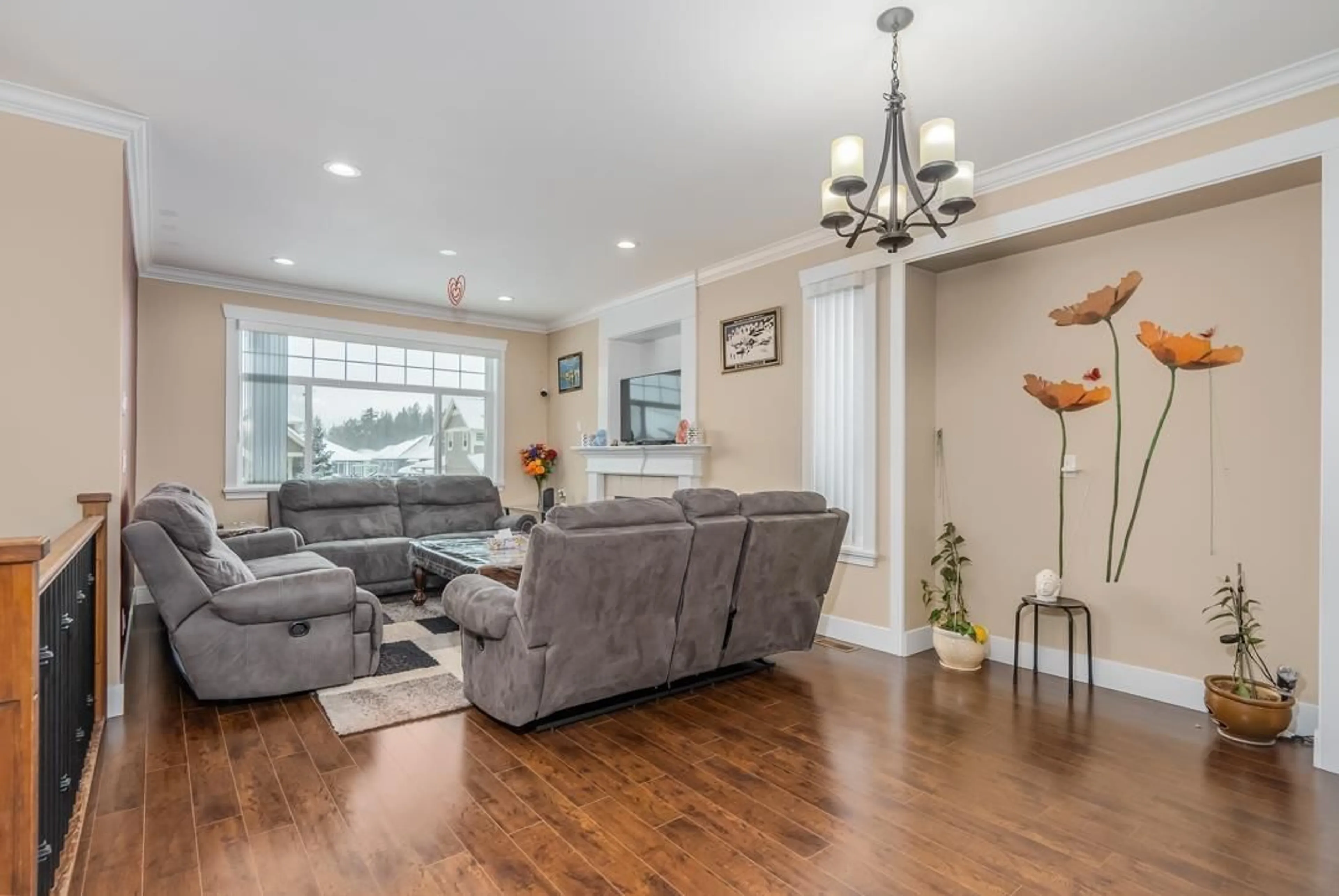 Living room with furniture, wood/laminate floor for 3118 ENGINEER COURT, Abbotsford British Columbia V4X0A7