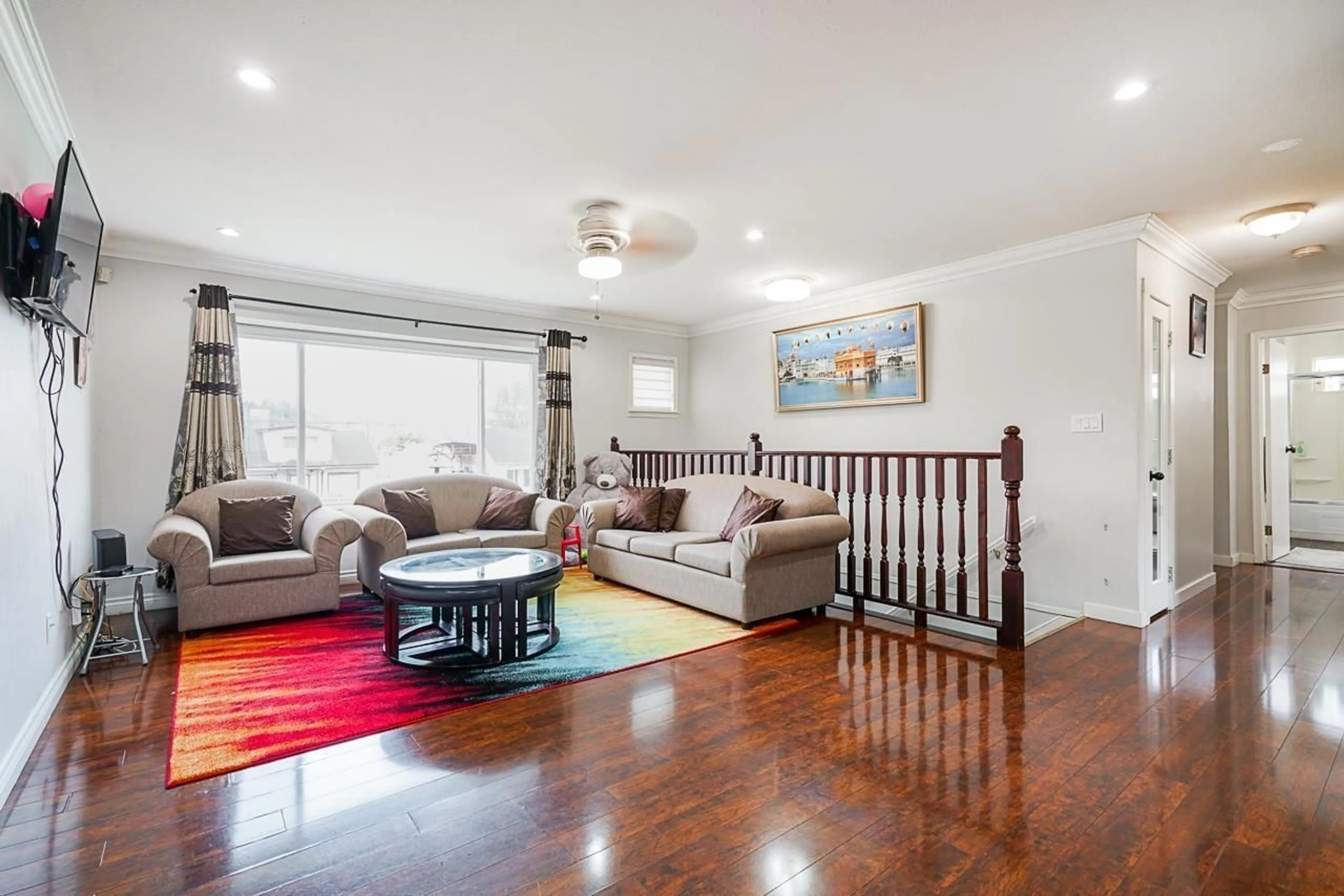 Living room with furniture, wood/laminate floor for 12707 112B AVENUE, Surrey British Columbia V3V3L7