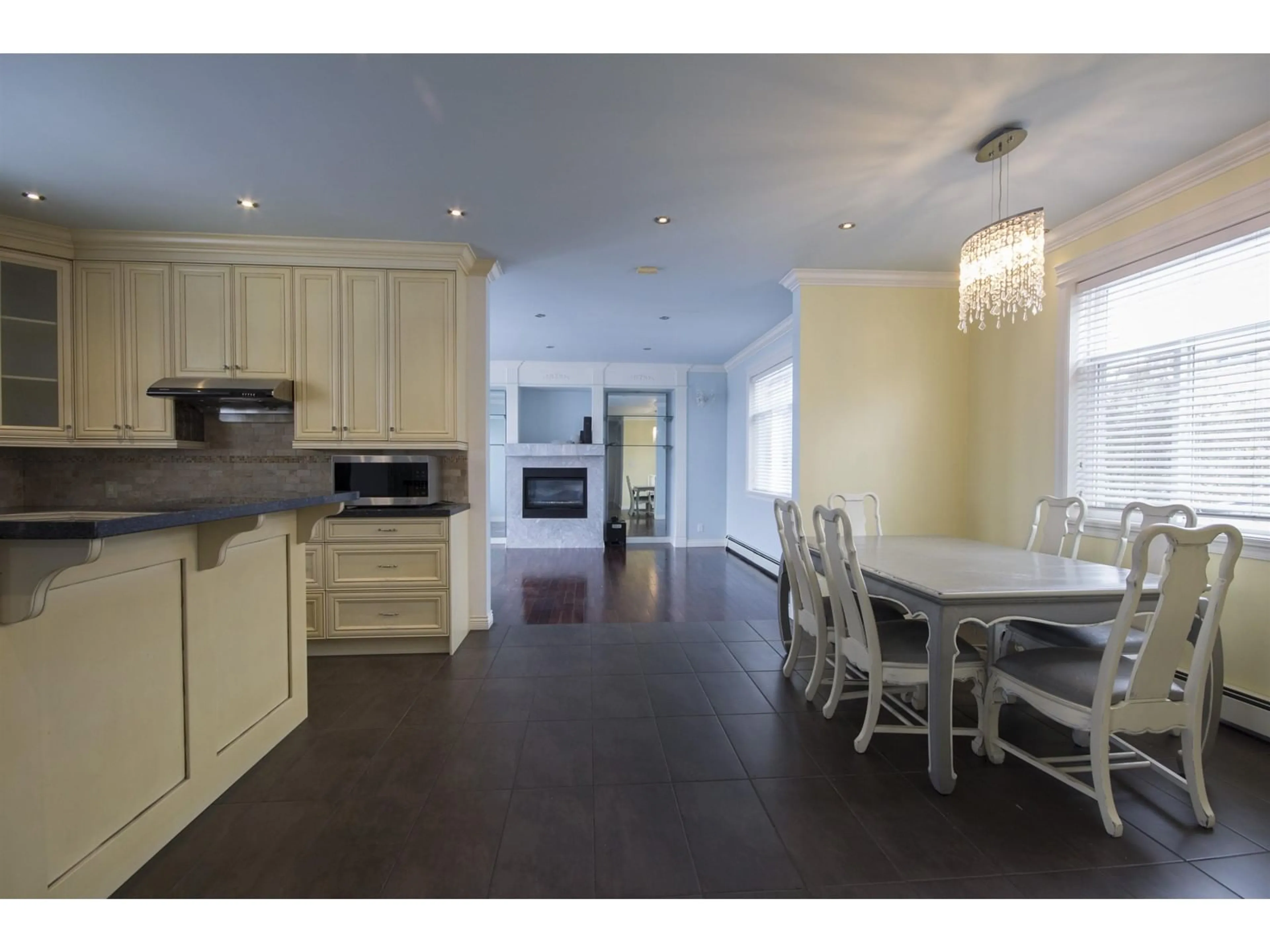 Open concept kitchen, wood/laminate floor for 12136 100A, Surrey British Columbia V3V2Y5