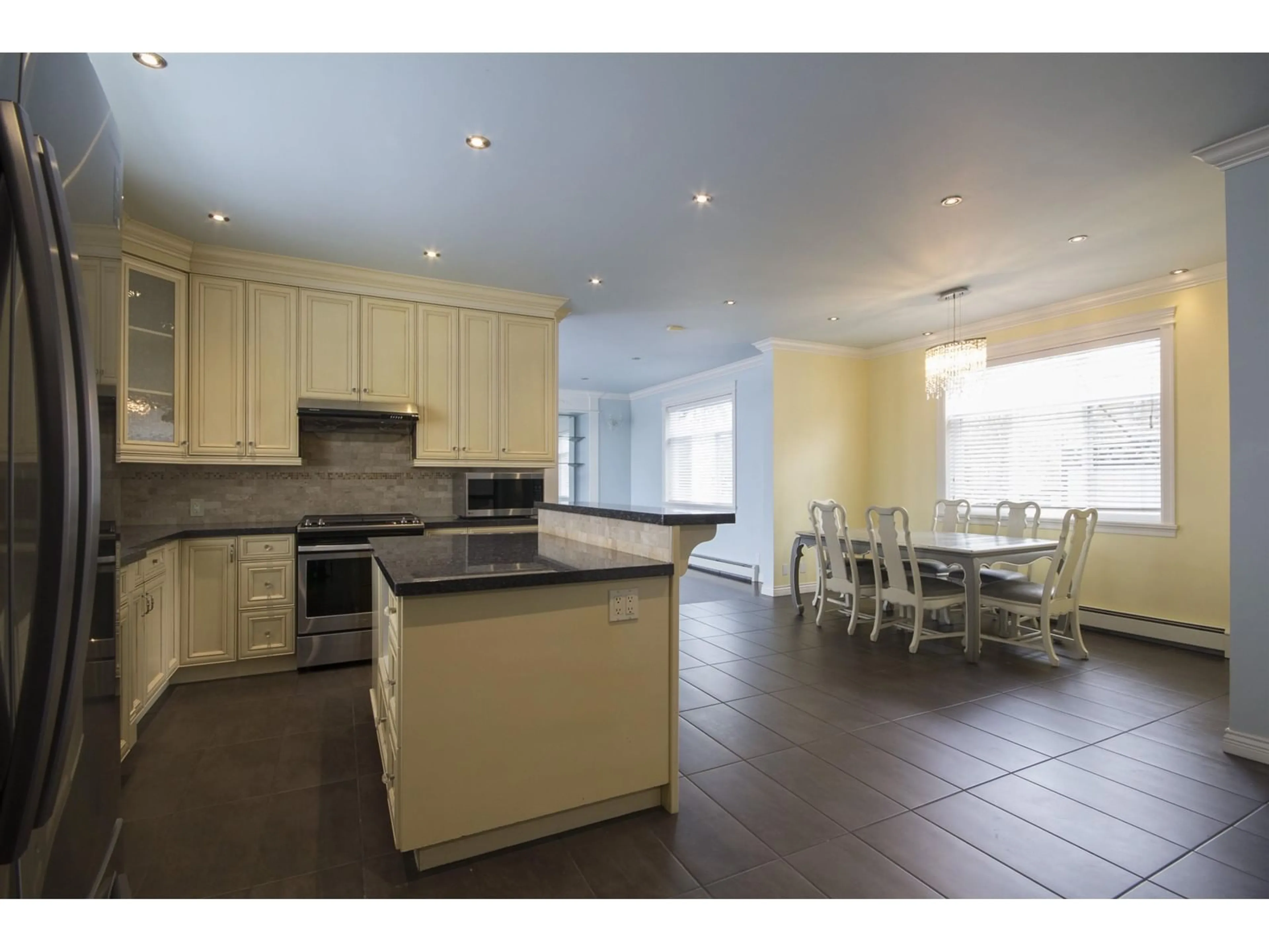 Open concept kitchen, ceramic/tile floor for 12136 100A AVENUE, Surrey British Columbia V3V2Y5