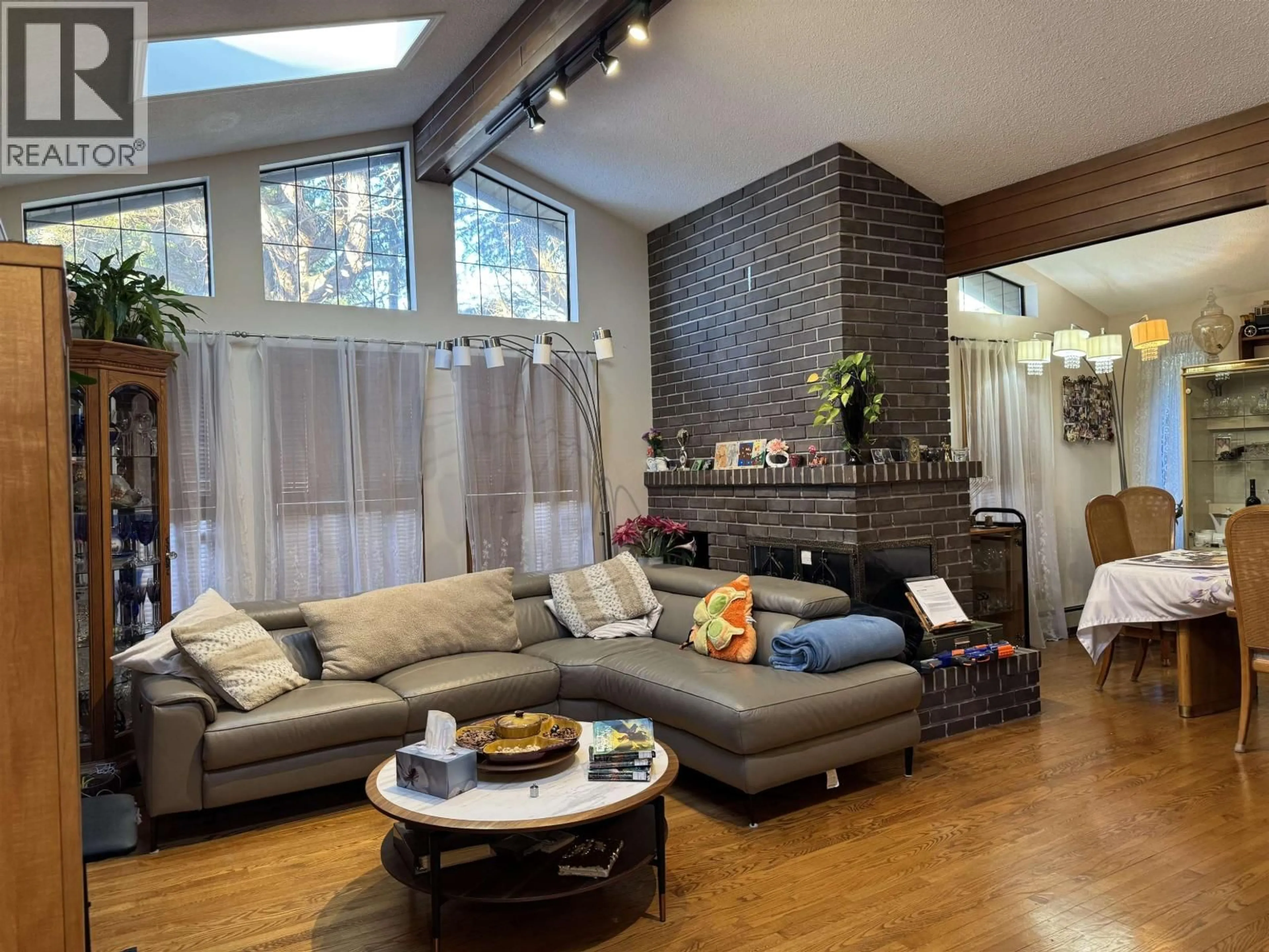 Living room with furniture, wood/laminate floor for 4360 COVENTRY DRIVE, Richmond British Columbia V7C4R2