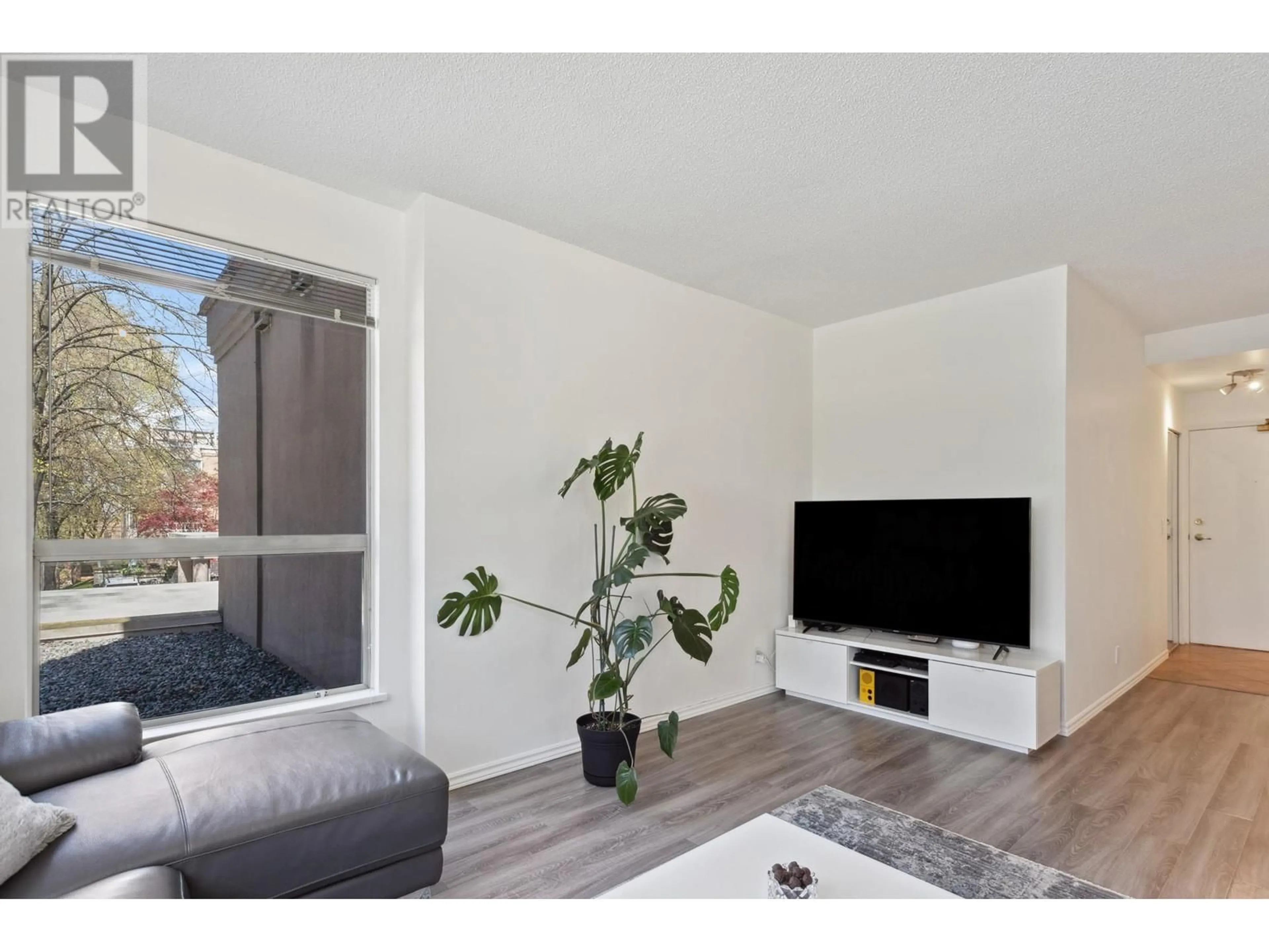 Living room with furniture, wood/laminate floor for 201 2668 ASH STREET, Vancouver British Columbia V5Z4K4