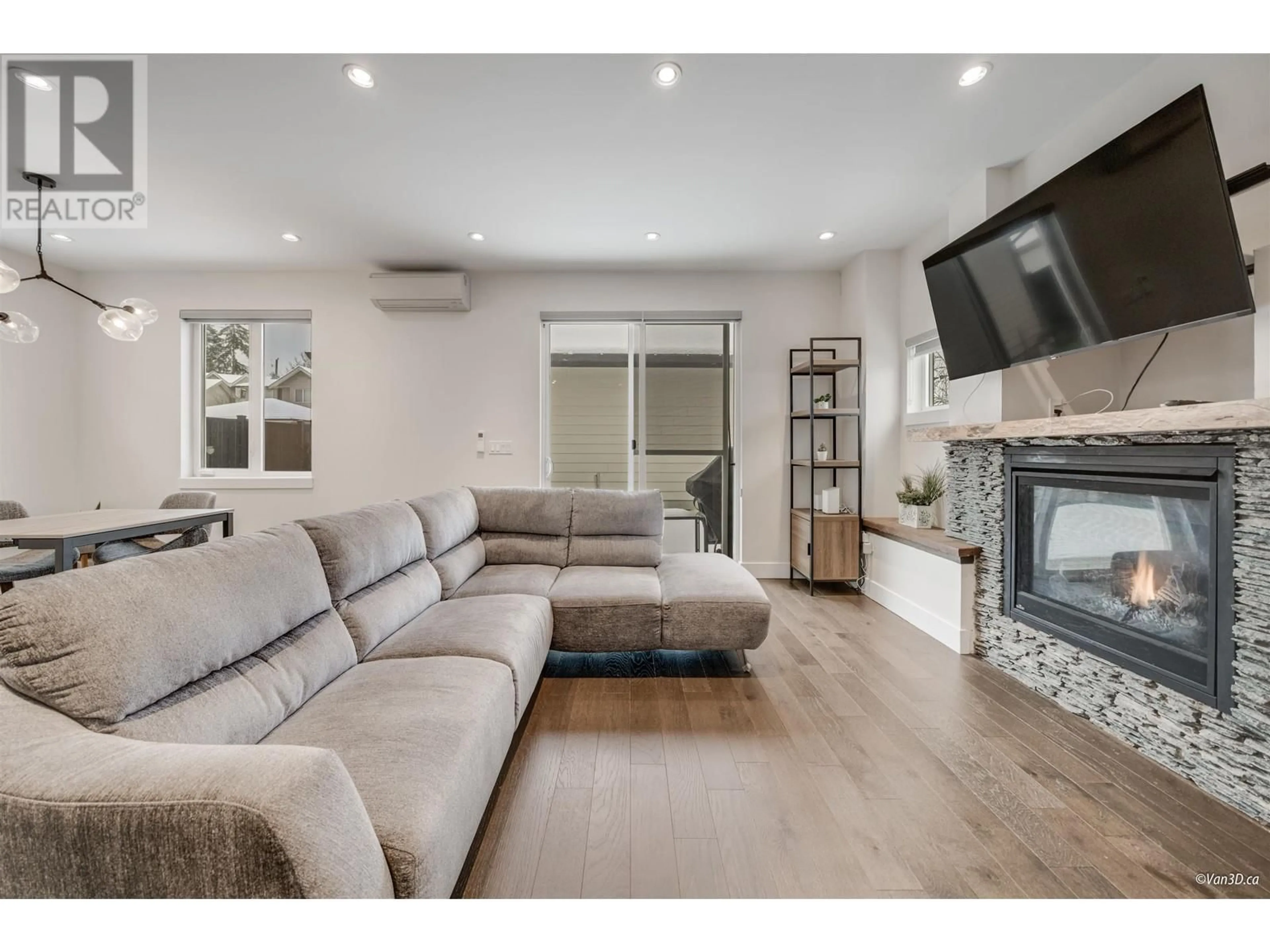 Living room with furniture, wood/laminate floor for 101 - 718 MORRISON AVENUE, Coquitlam British Columbia V3J4H7