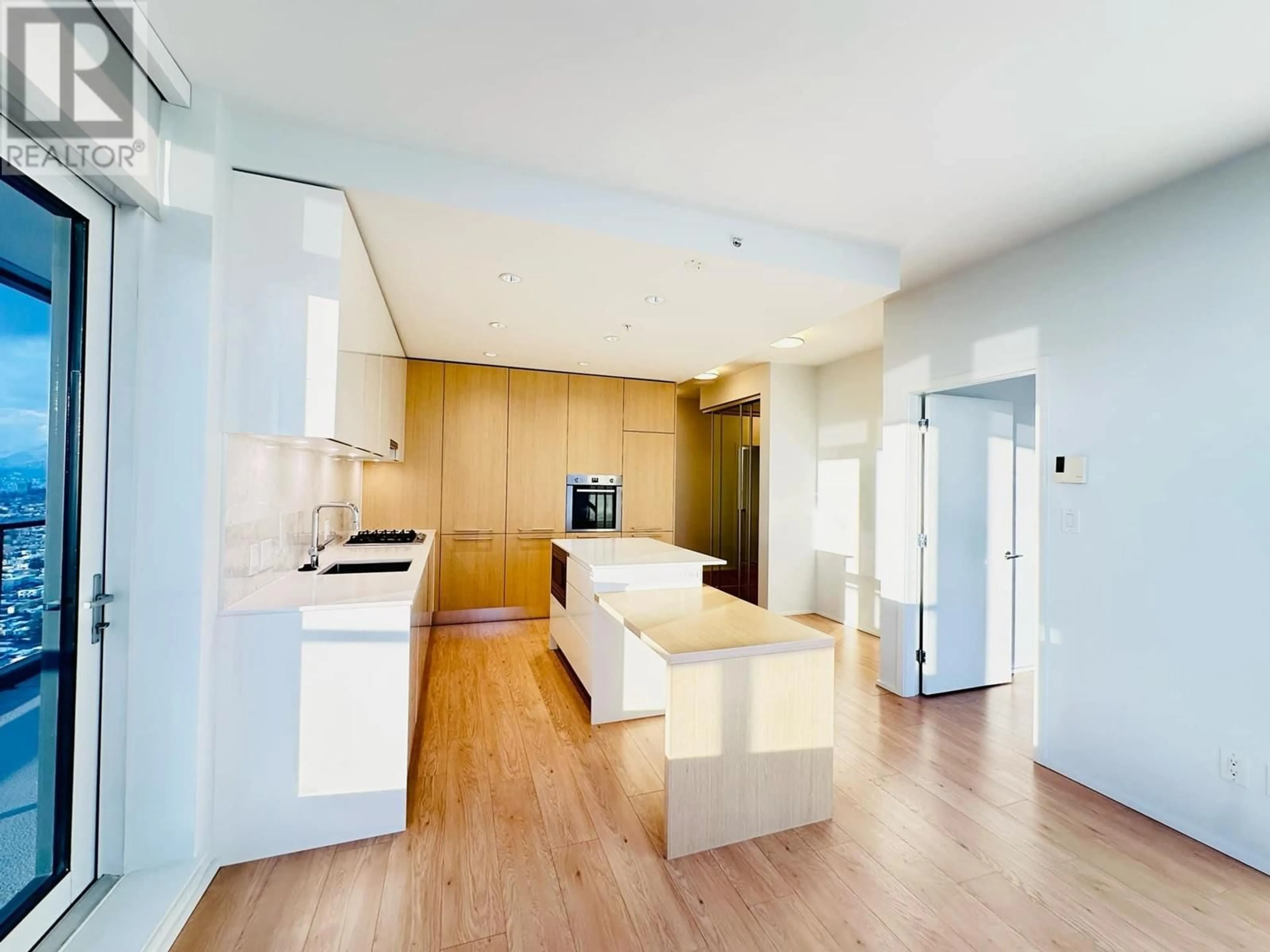 Open concept kitchen, wood/laminate floor for 5007 - 4510 HALIFAX WAY, Burnaby British Columbia V5C0K4