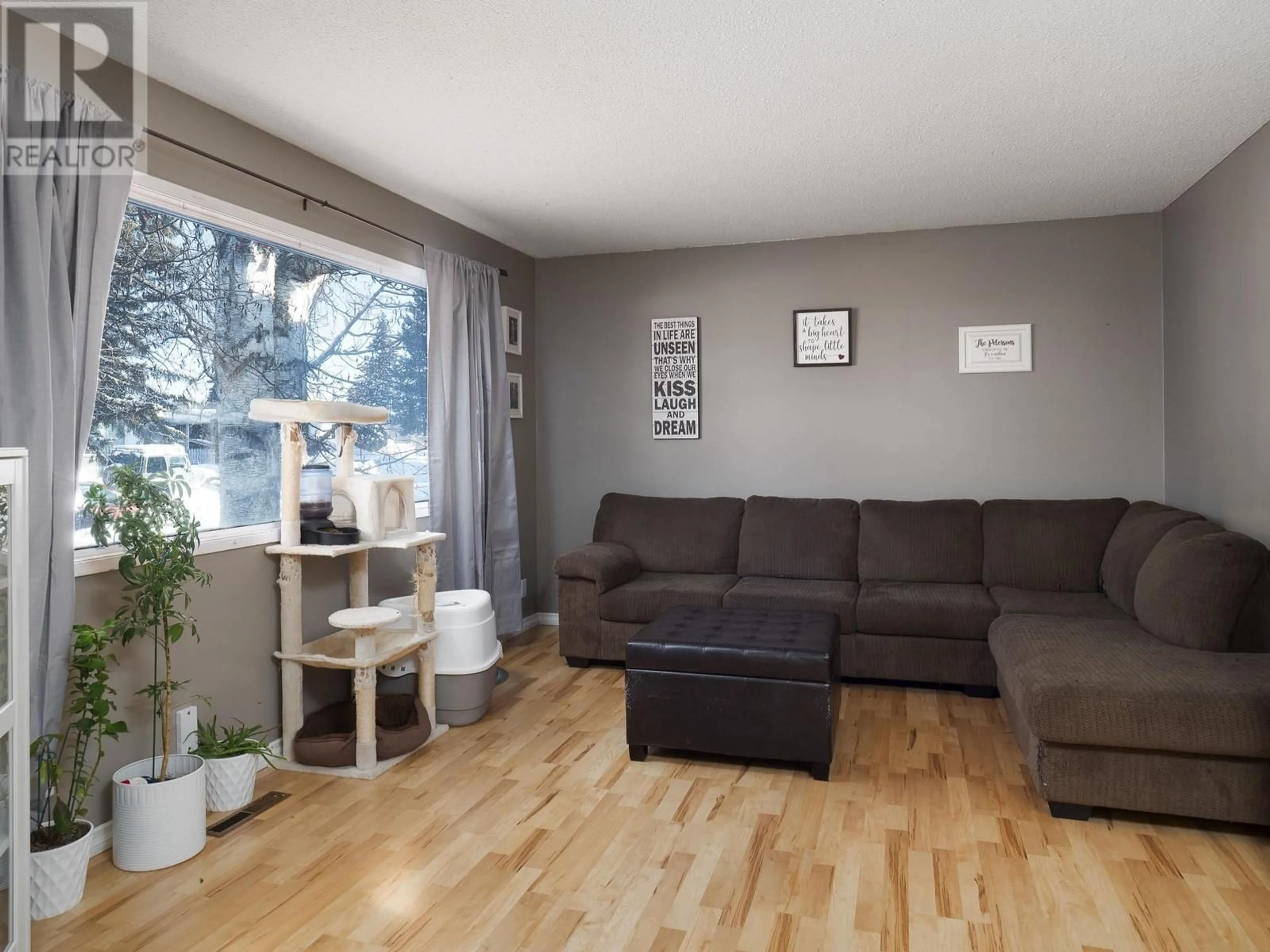 Living room with furniture, wood/laminate floor for 143 FERN CRESCENT, Prince George British Columbia V2N1J3