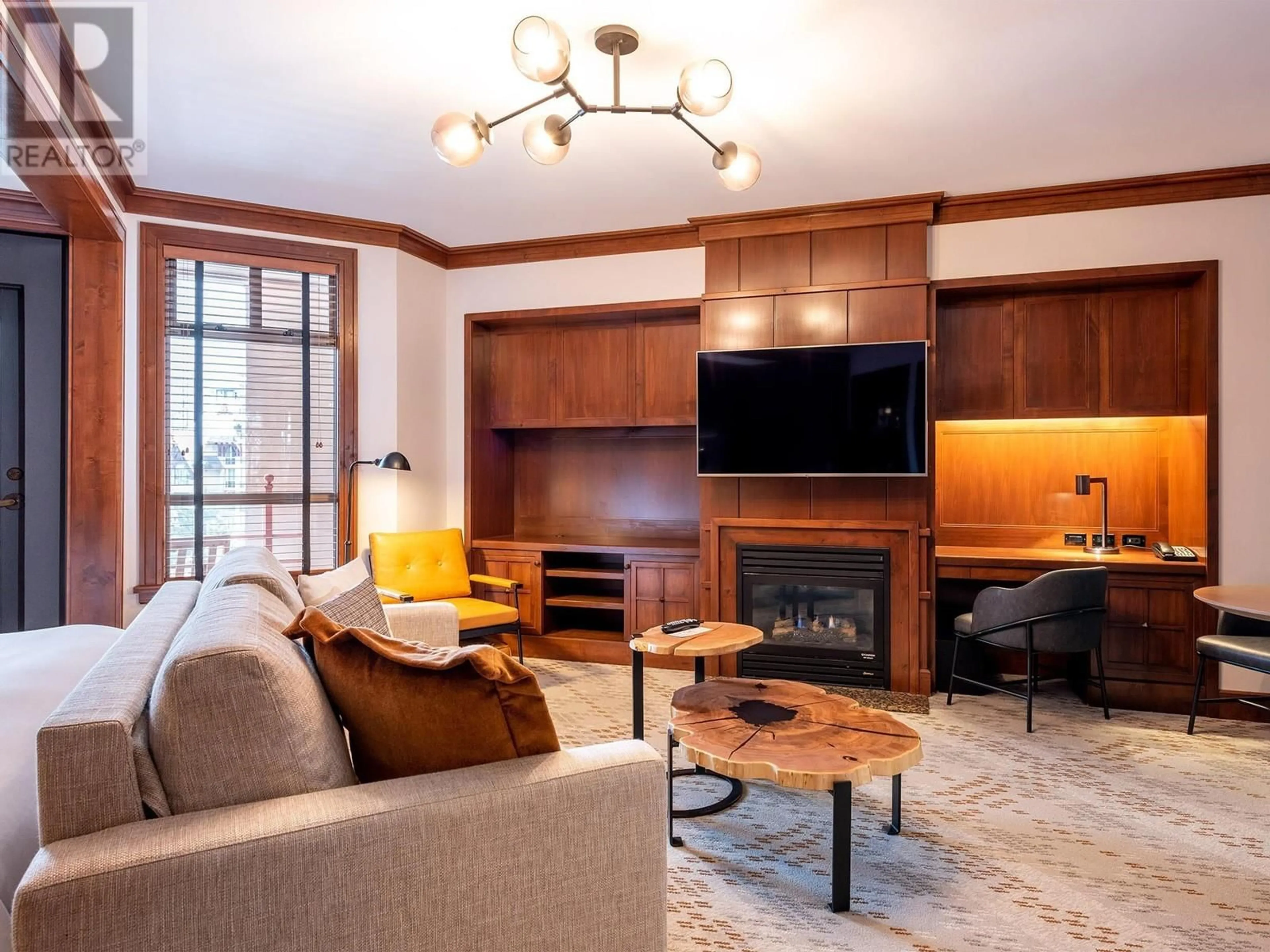 Living room with furniture, wood/laminate floor for 607 4591 BLACKCOMB WAY, Whistler British Columbia V8E0Y4