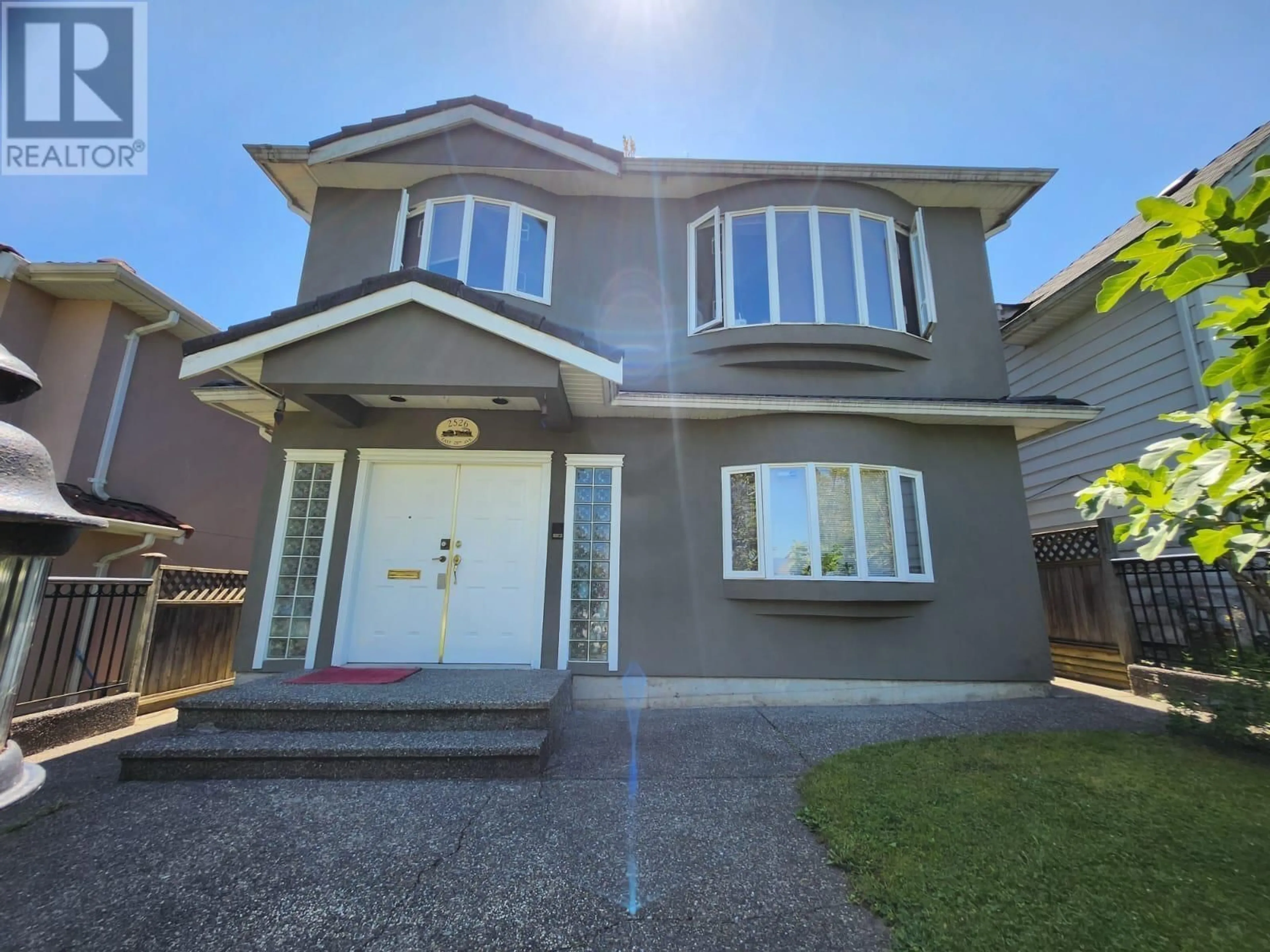 Home with vinyl exterior material, street for 2526 28TH AVENUE, Vancouver British Columbia V5R1R6