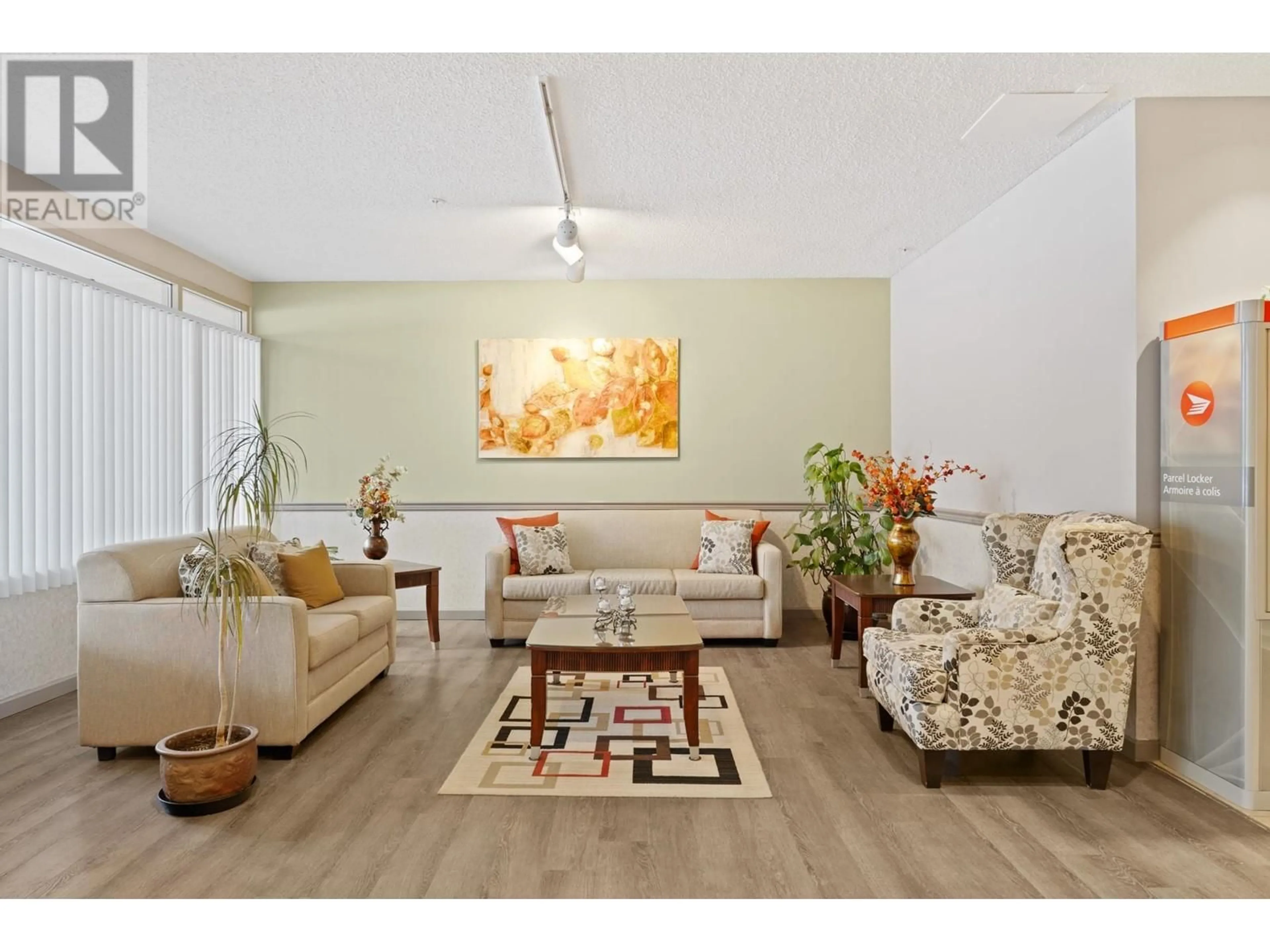 Living room with furniture, wood/laminate floor for 307 1190 PIPELINE ROAD, Coquitlam British Columbia V3B7T9