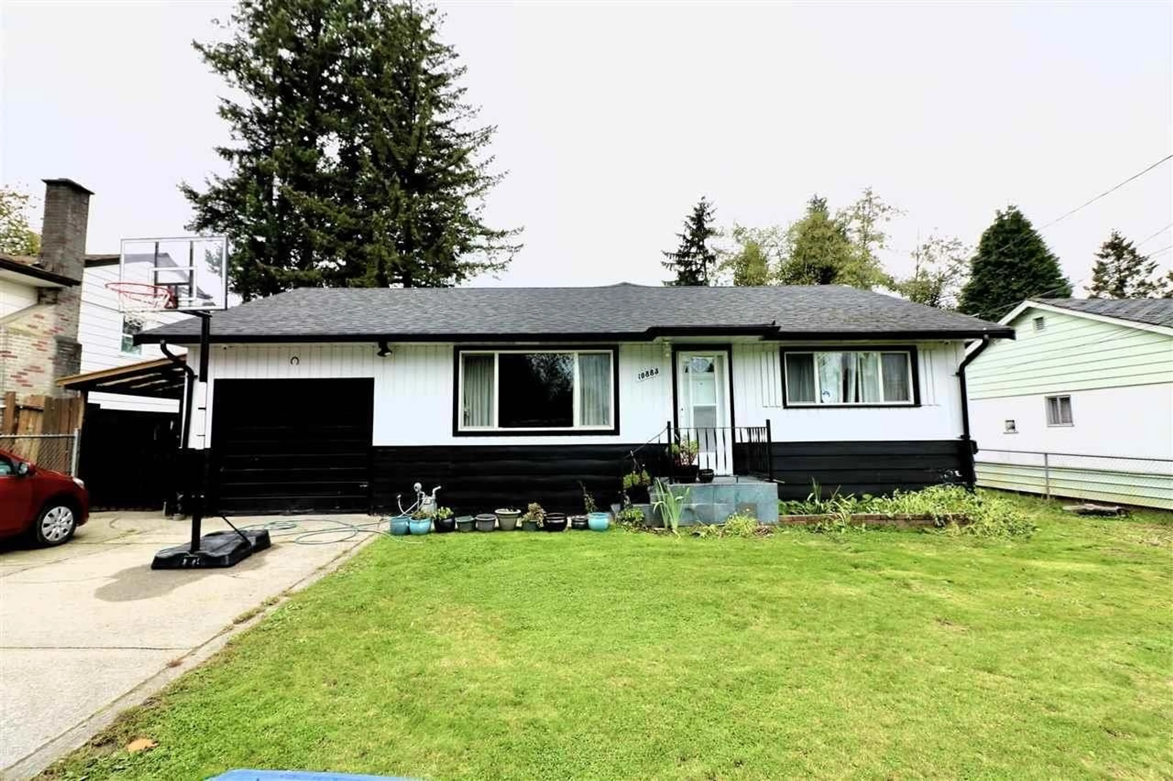 Home with vinyl exterior material, street for 10883 146 STREET, Surrey British Columbia V3R3T7