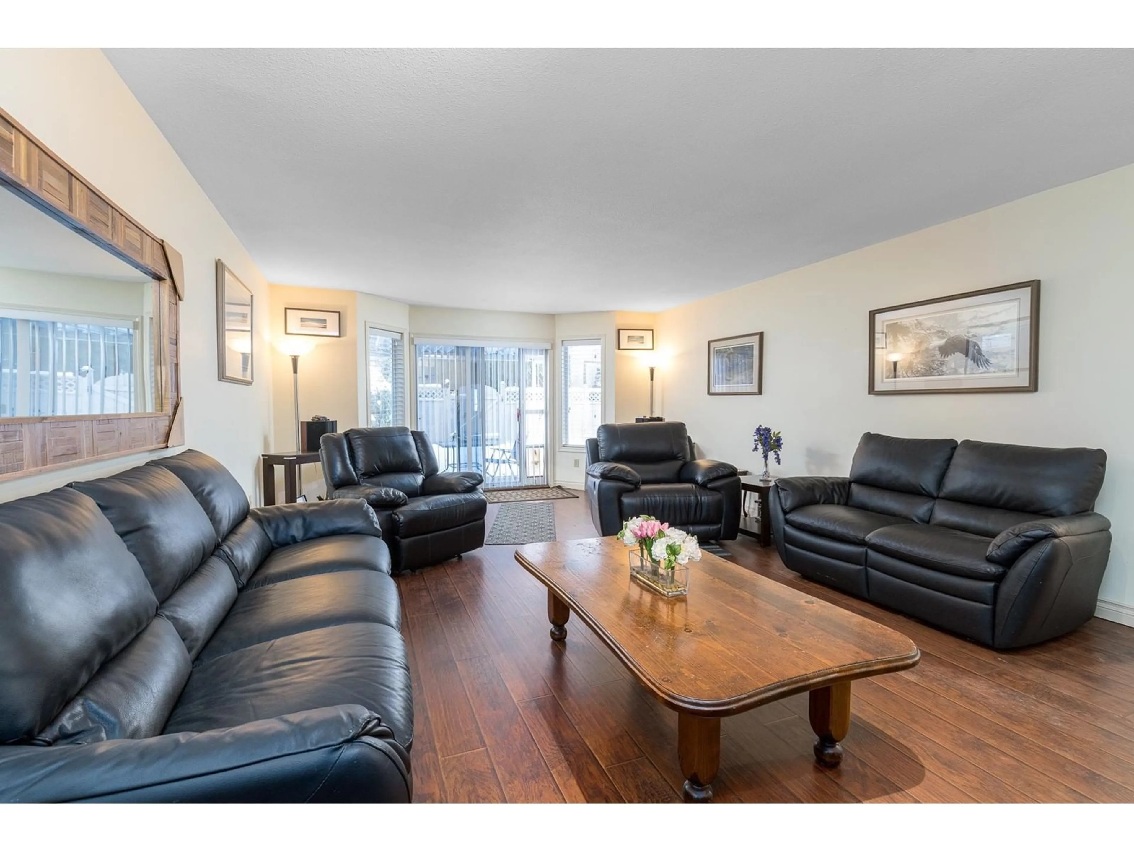 Living room with furniture, wood/laminate floor for 18 5051 203 STREET, Langley British Columbia V3A1V5