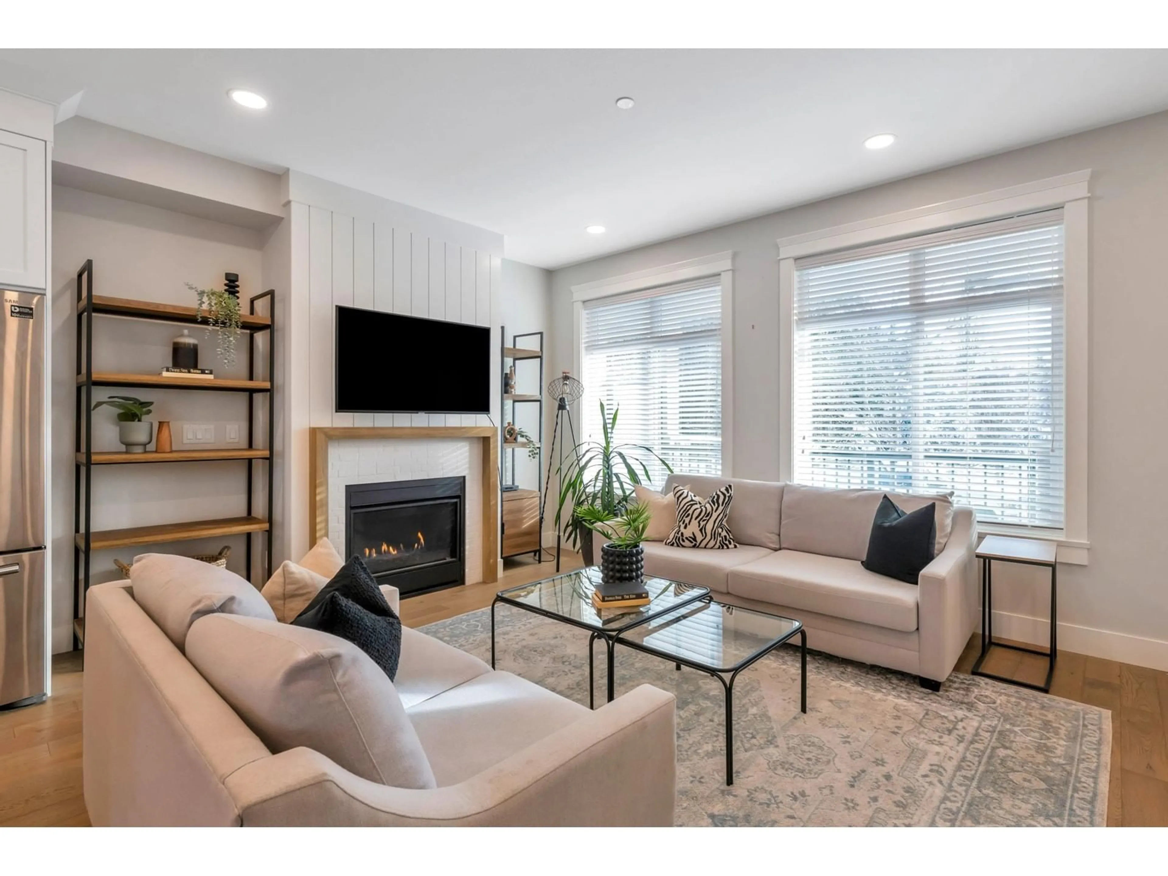 Living room with furniture, wood/laminate floor for 102 8217 204B STREET, Langley British Columbia V2Y0Z8