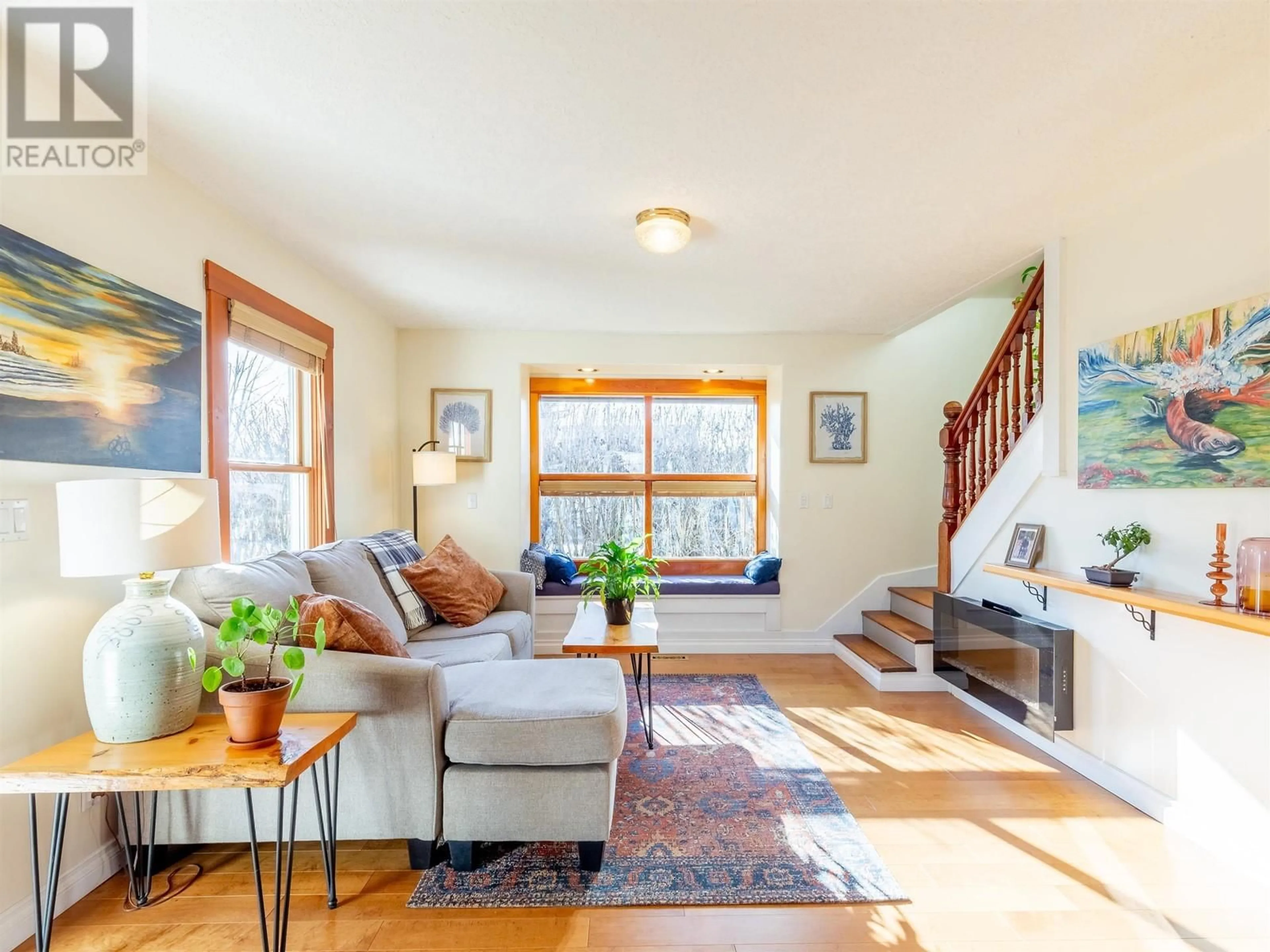 Living room with furniture, wood/laminate floor for 3907 2ND AVENUE, Smithers British Columbia V0J2N0