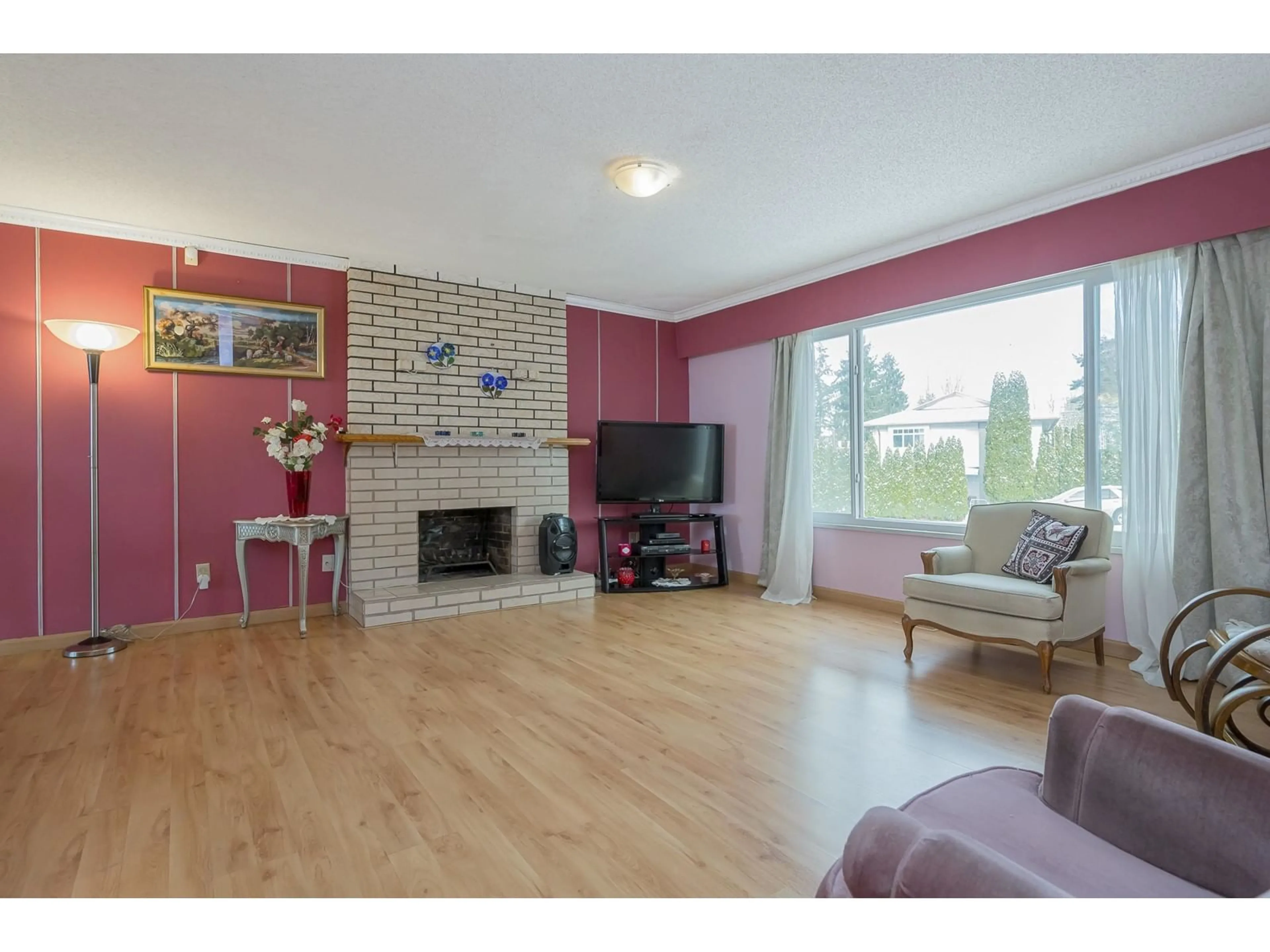 Living room with furniture, wood/laminate floor for 13248 98A AVENUE, Surrey British Columbia V3T5E7