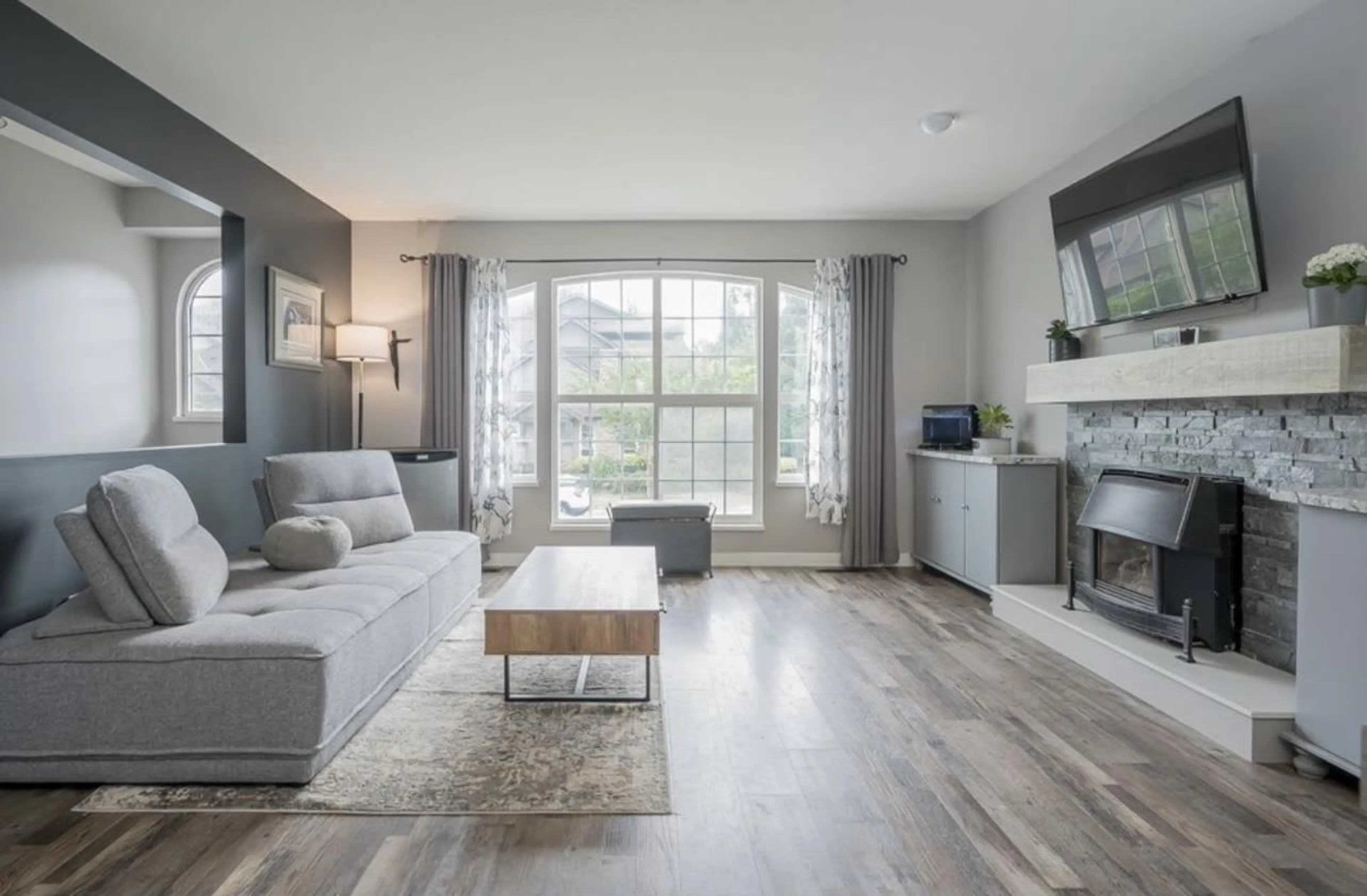 Living room with furniture, wood/laminate floor for 5001 218A STREET, Langley British Columbia V3A8K2