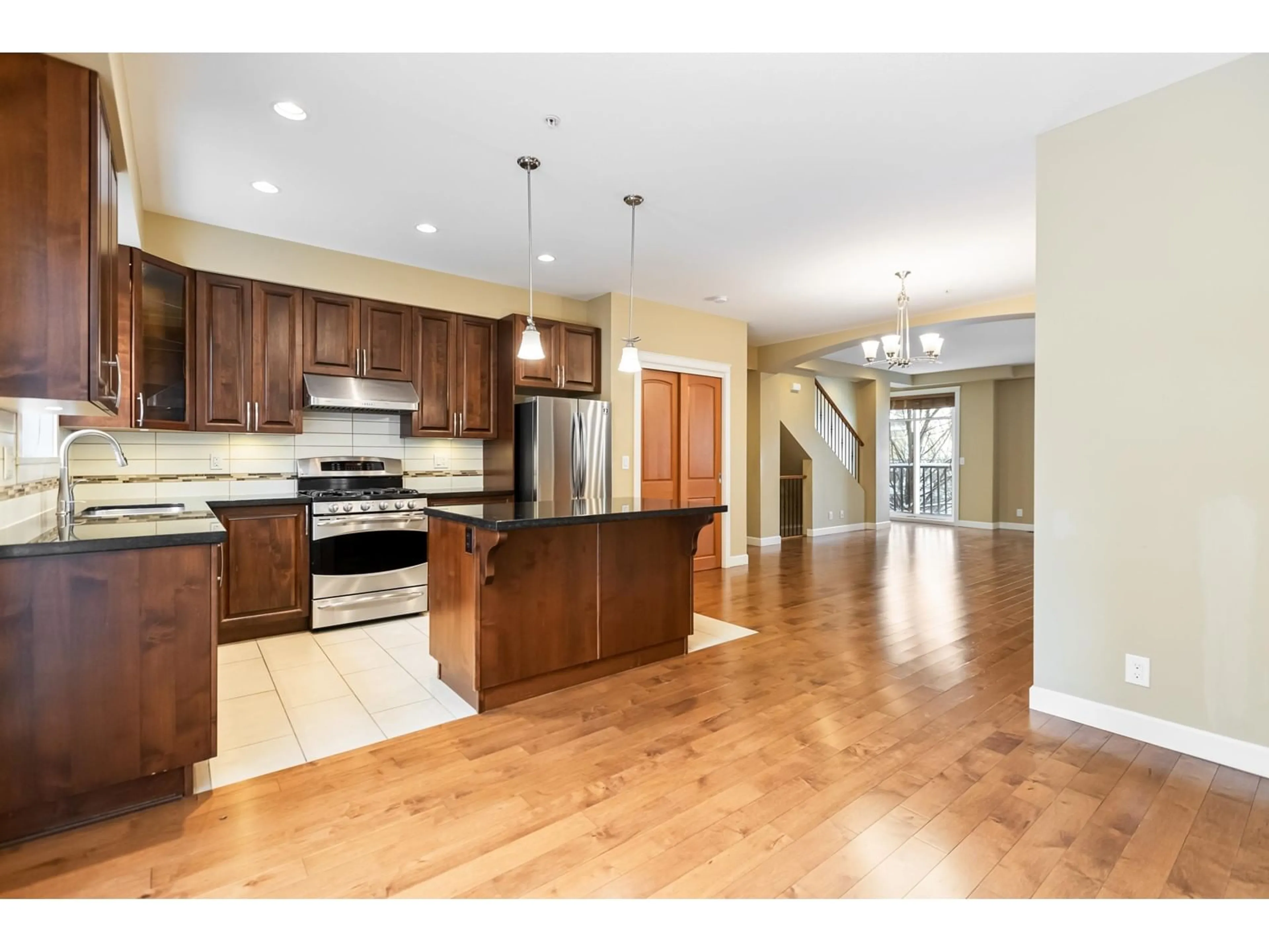 Open concept kitchen, wood/laminate floor for 7 20738 84TH AVENUE, Langley British Columbia V2Y0J6