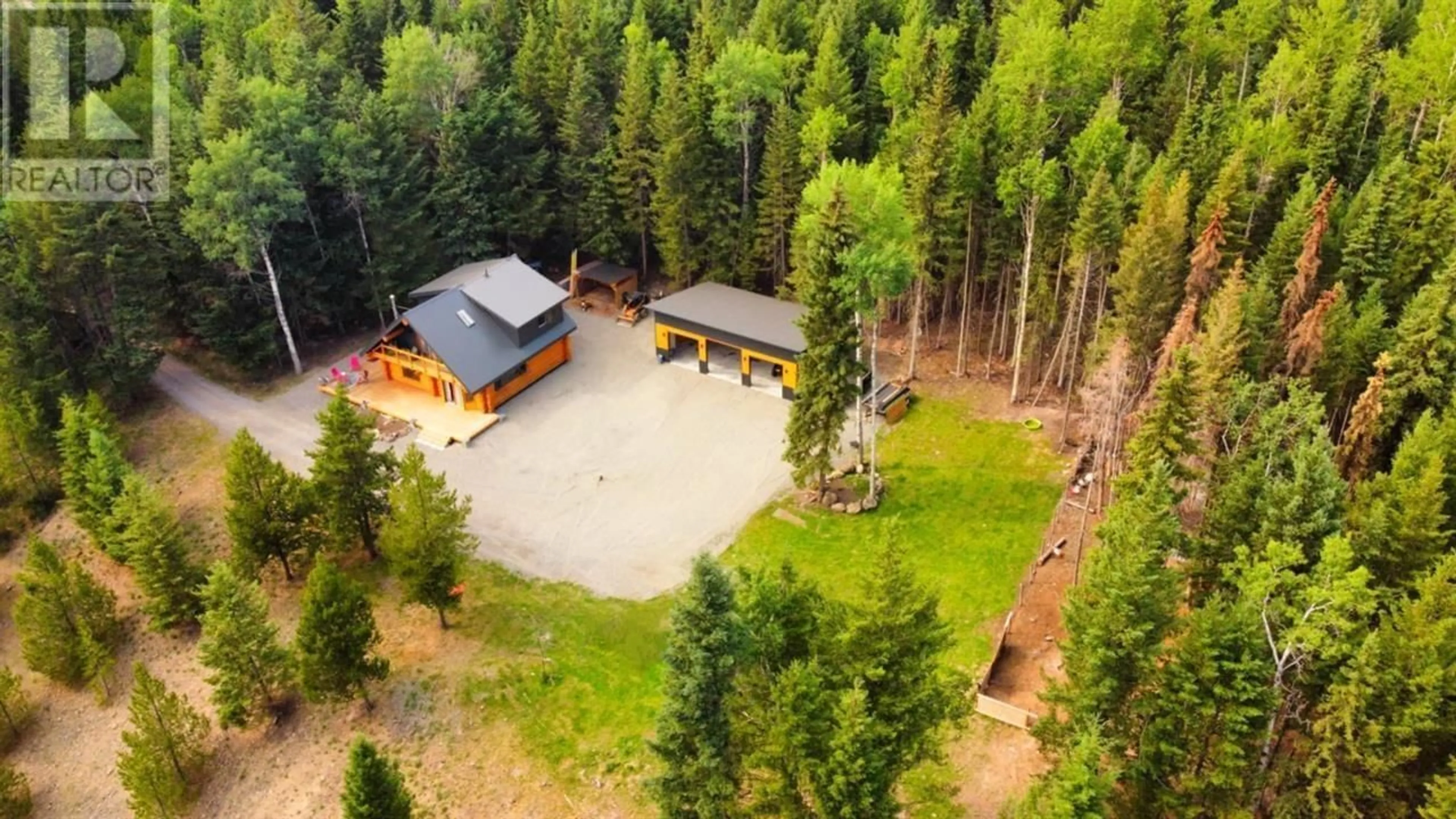 A pic from outside/outdoor area/front of a property/back of a property/a pic from drone, unknown for 6847 FAWN LK AC01 ROAD, 100 Mile House British Columbia V0K1X1