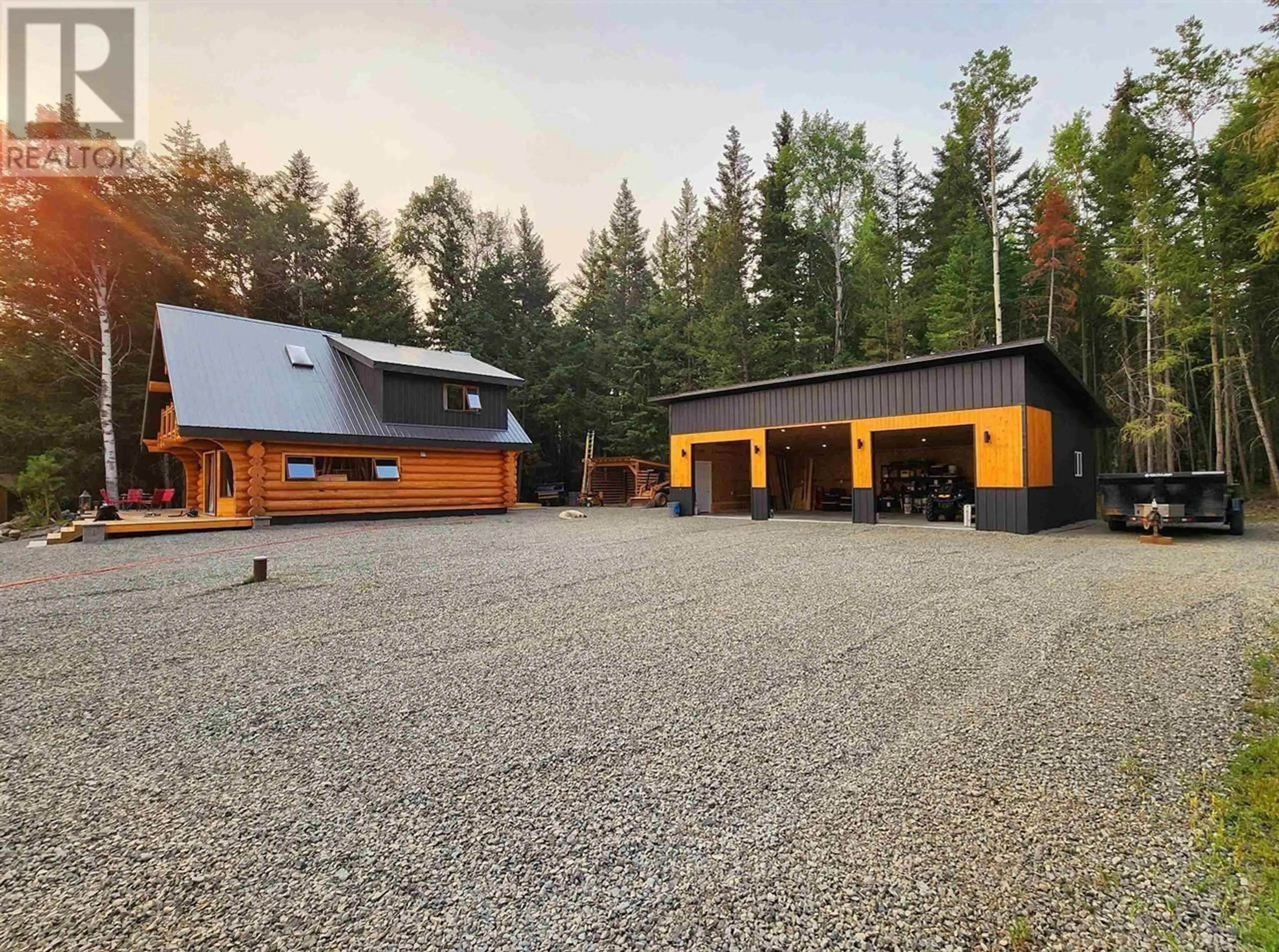 A pic from outside/outdoor area/front of a property/back of a property/a pic from drone, unknown for 6847 FAWN LK AC01 ROAD, 100 Mile House British Columbia V0K1X1