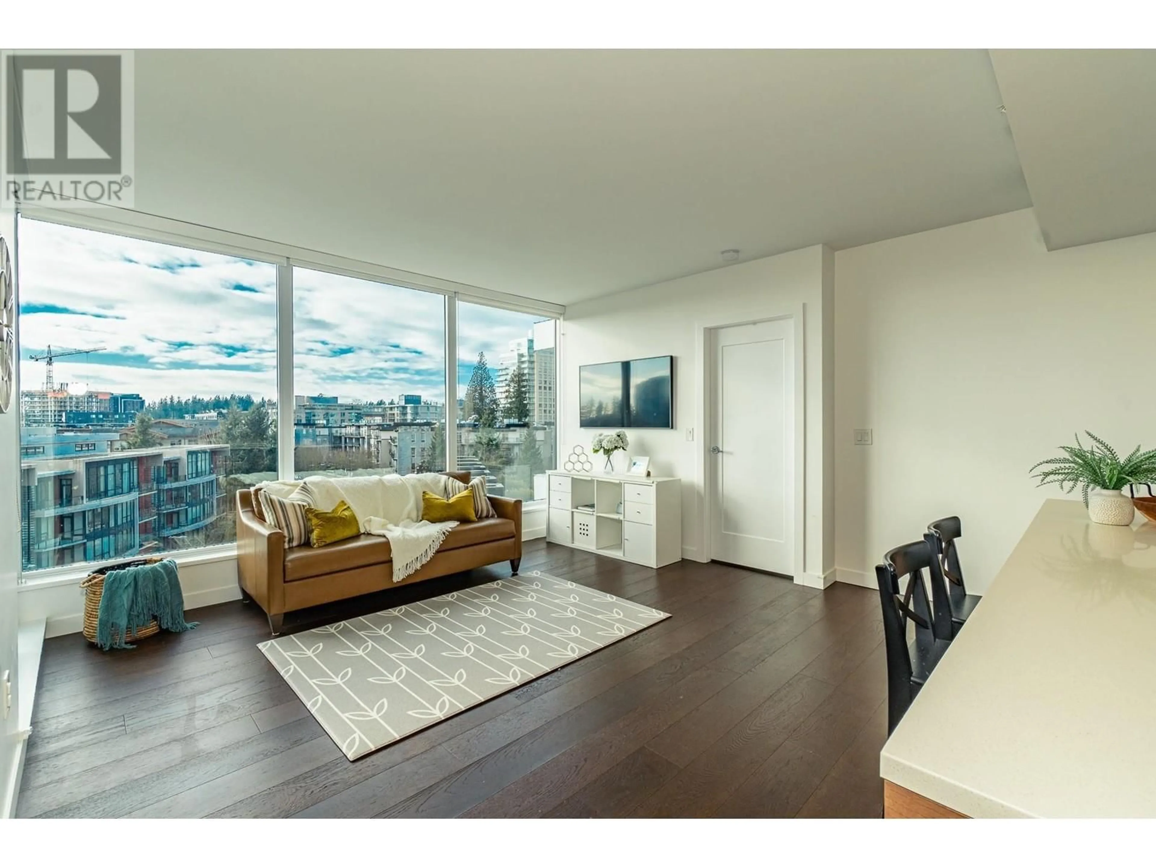 Living room with furniture, wood/laminate floor for 609 5629 BIRNEY AVENUE, Vancouver British Columbia V6S0L5