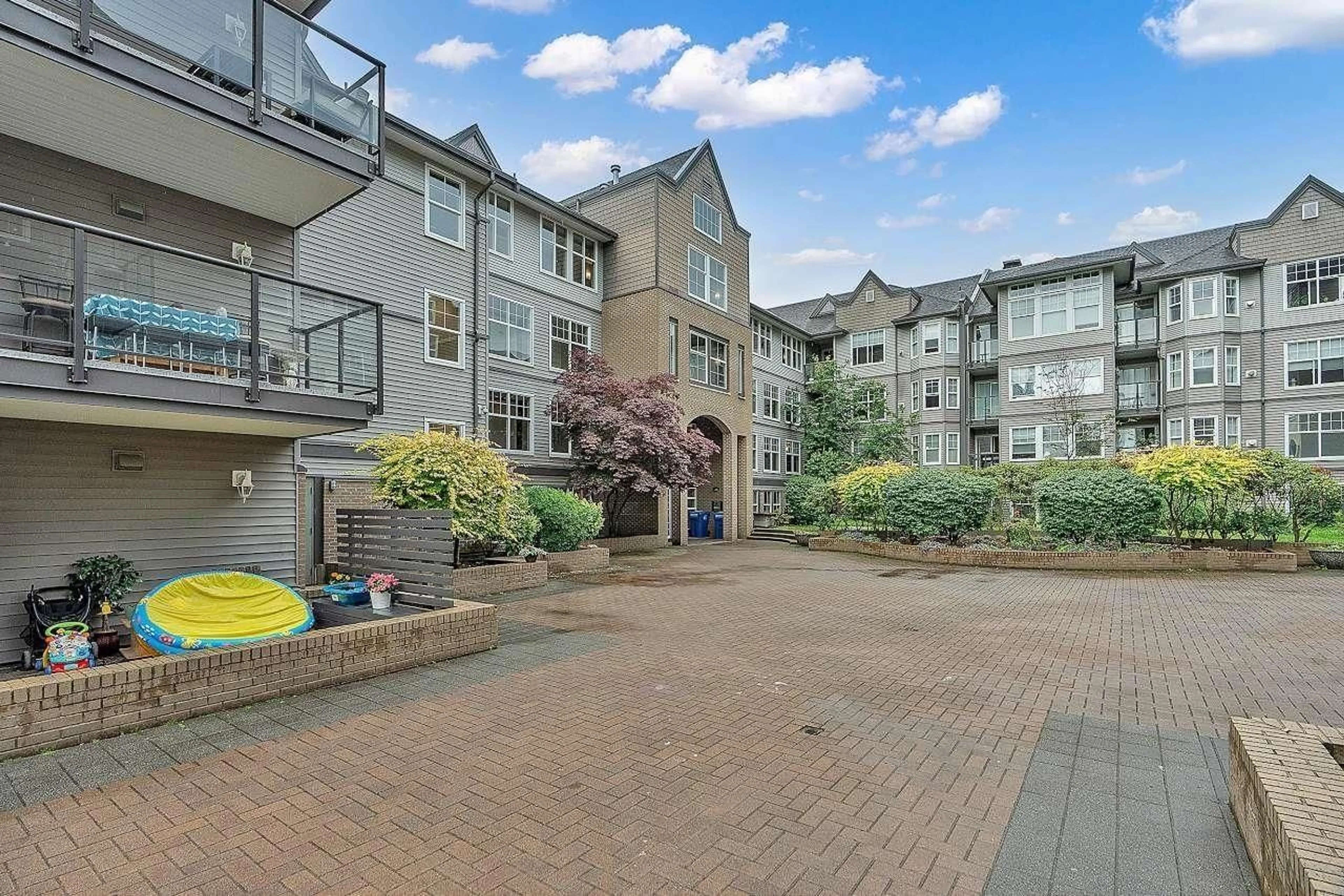 A pic from outside/outdoor area/front of a property/back of a property/a pic from drone, street for 416 - 20200 56, Langley British Columbia V3A8S1