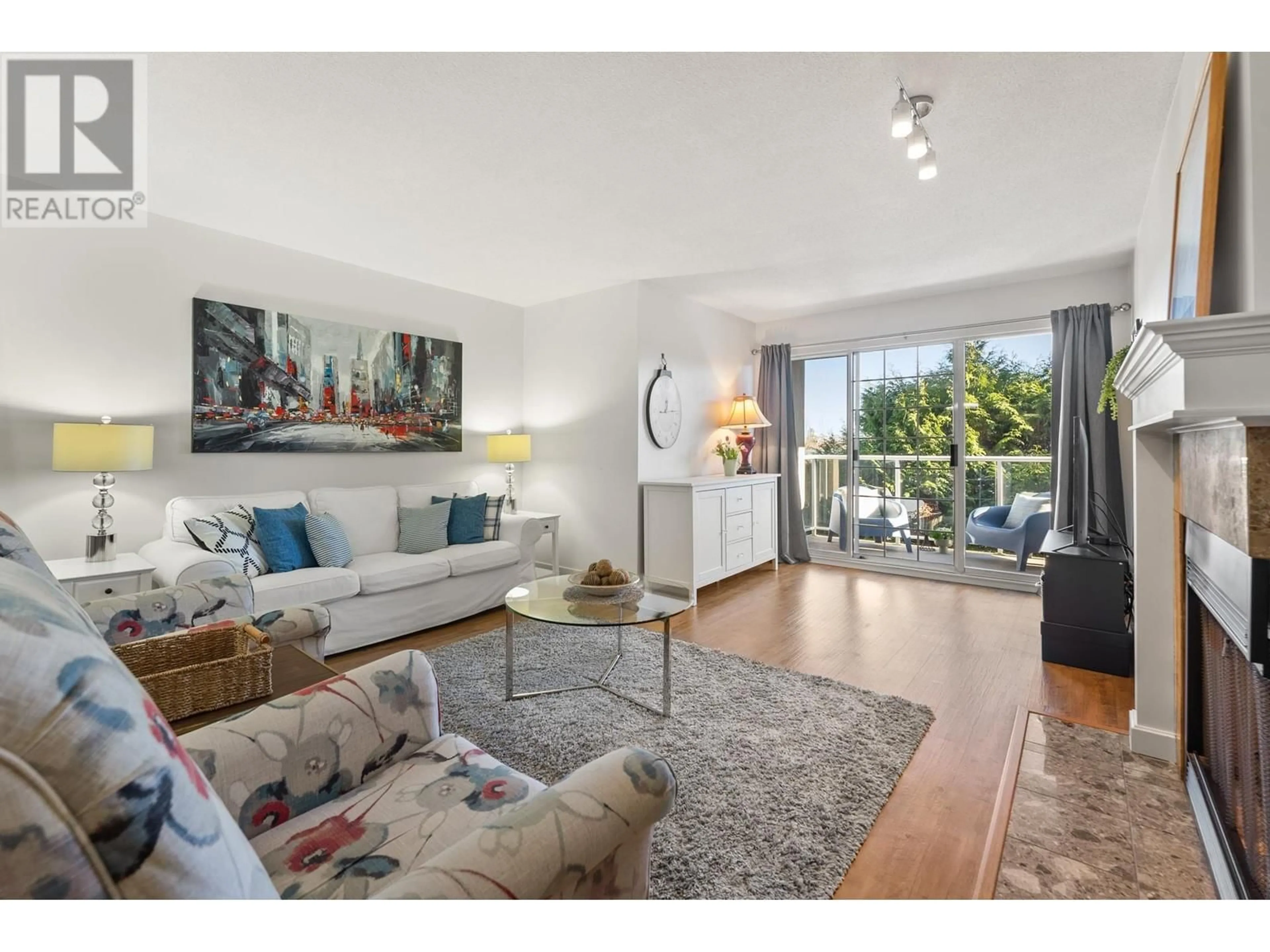 Living room with furniture, wood/laminate floor for 206 1140 55 STREET, Delta British Columbia V4M3J8