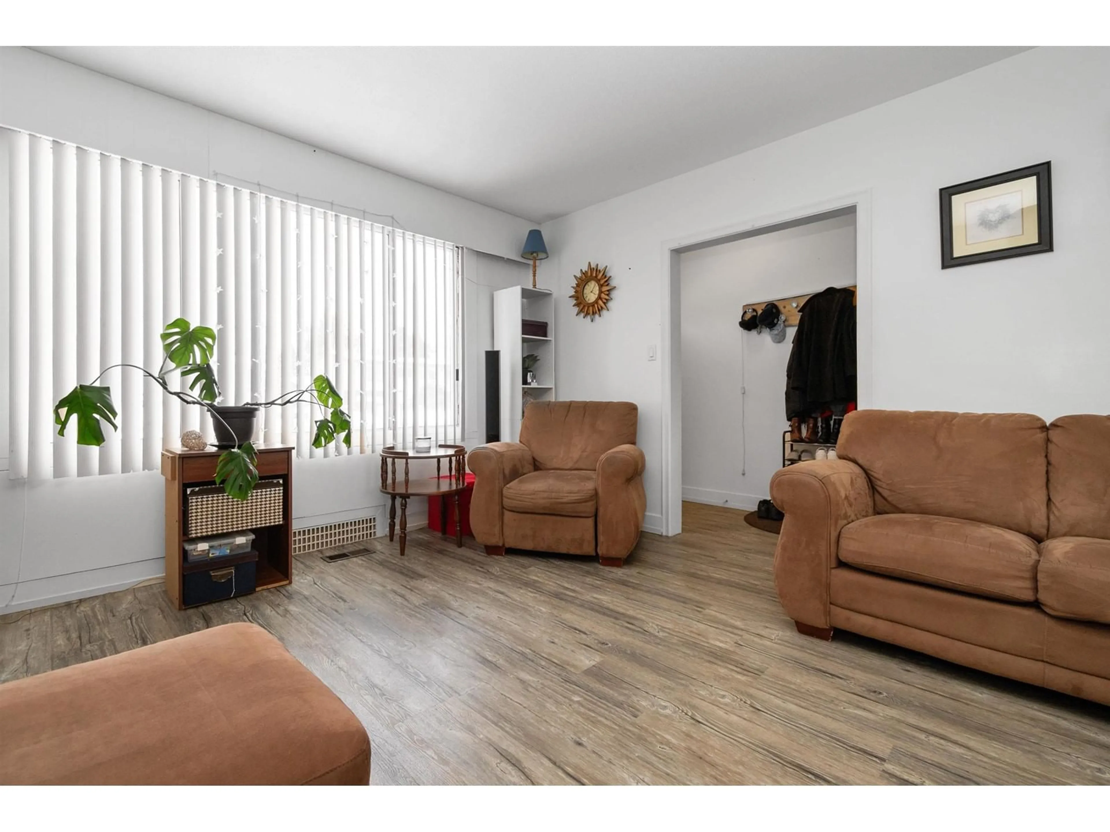 Living room with furniture, wood/laminate floor for 33608 7TH, Mission British Columbia V2V2G1