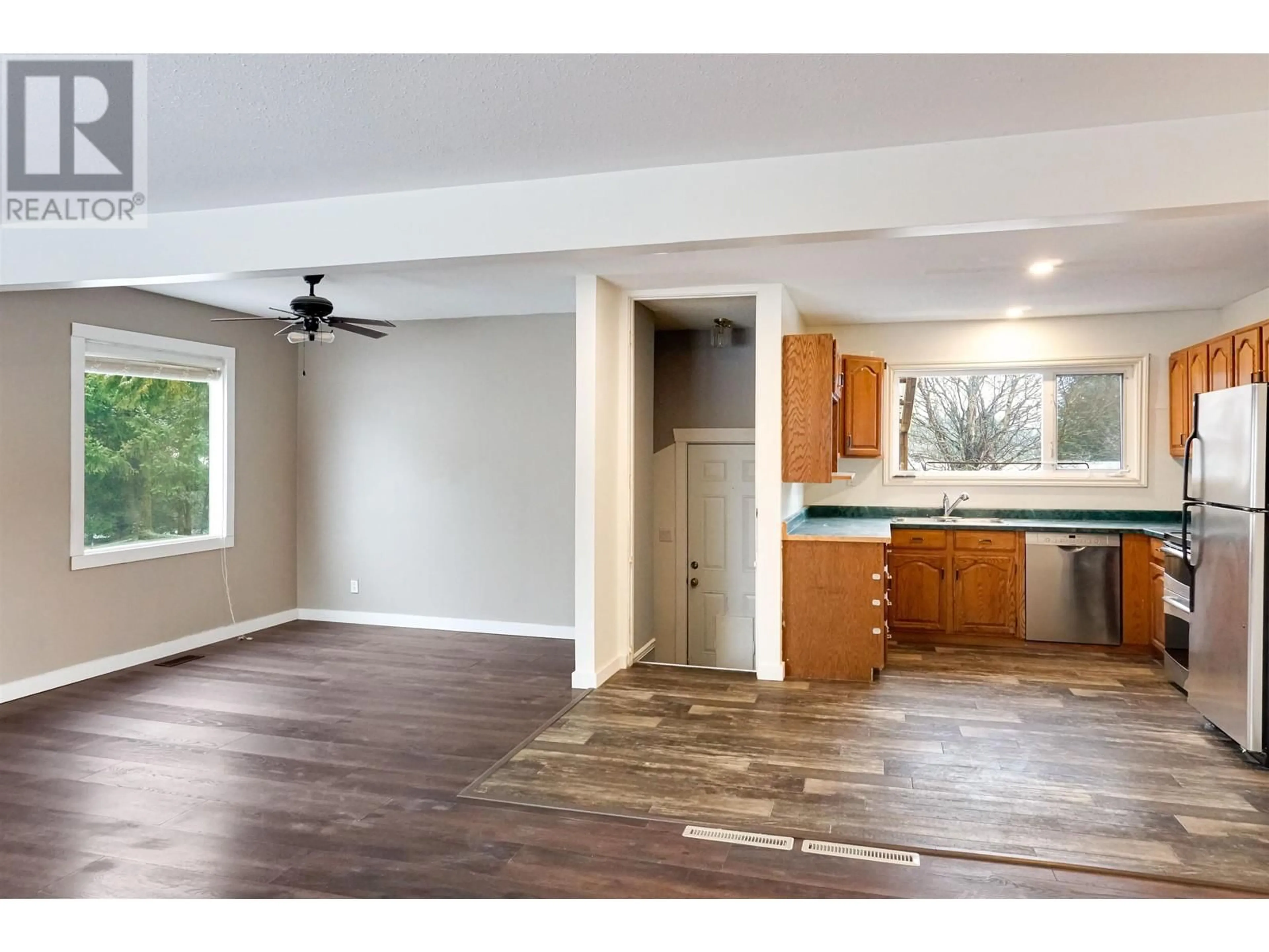 Open concept kitchen, wood/laminate floor for 83 BAKER STREET, Kitimat British Columbia V8C1A8