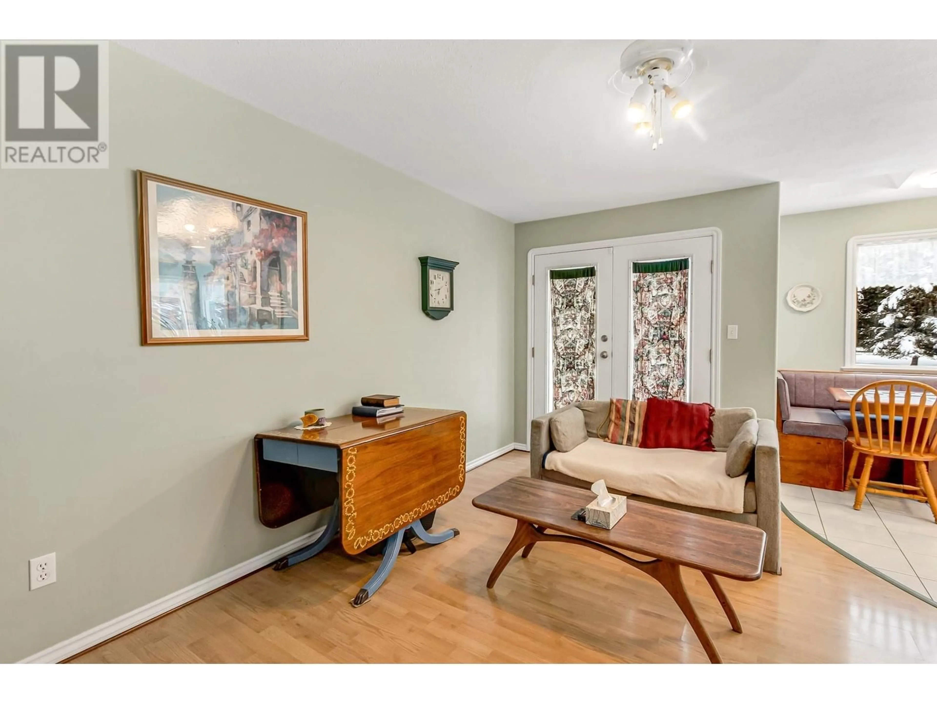 Living room with furniture, wood/laminate floor for 14145 S NECHAKO PLACE, Prince George British Columbia V2M7C1