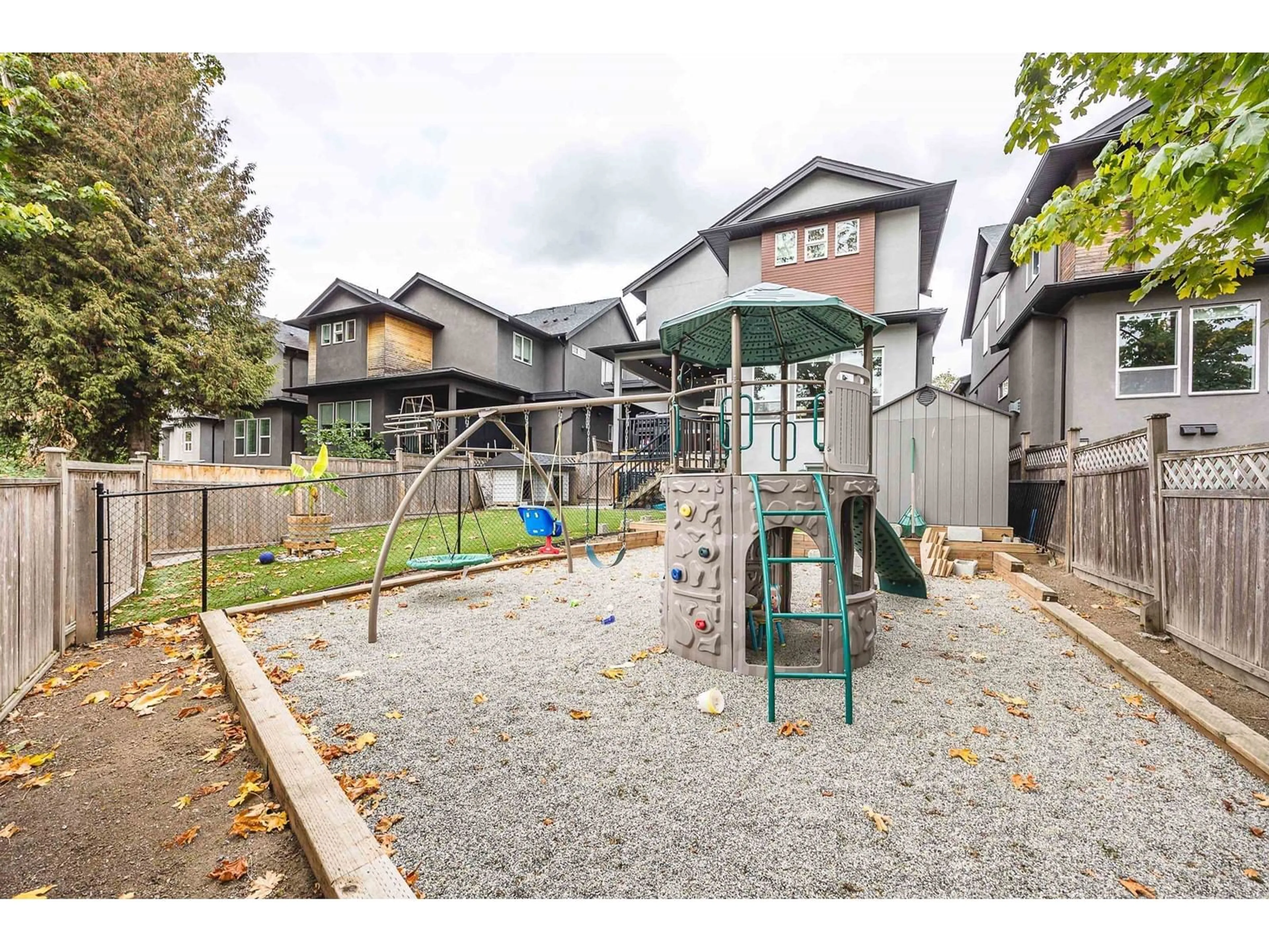 A pic from outside/outdoor area/front of a property/back of a property/a pic from drone, street for 15856 105A AVENUE, Surrey British Columbia V4N3J4