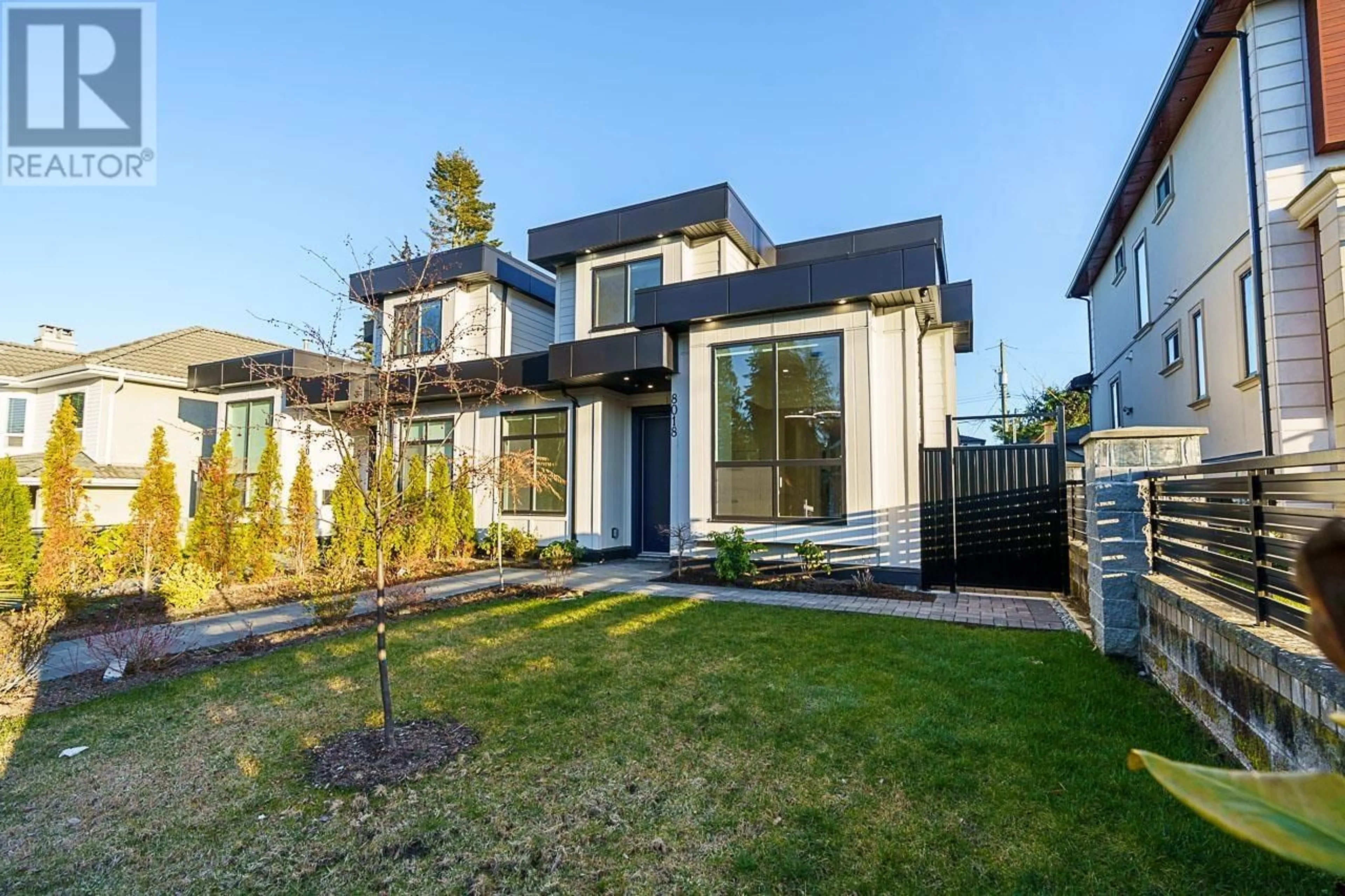 Home with brick exterior material, street for 8018 19TH AVENUE, Burnaby British Columbia V3N1G3