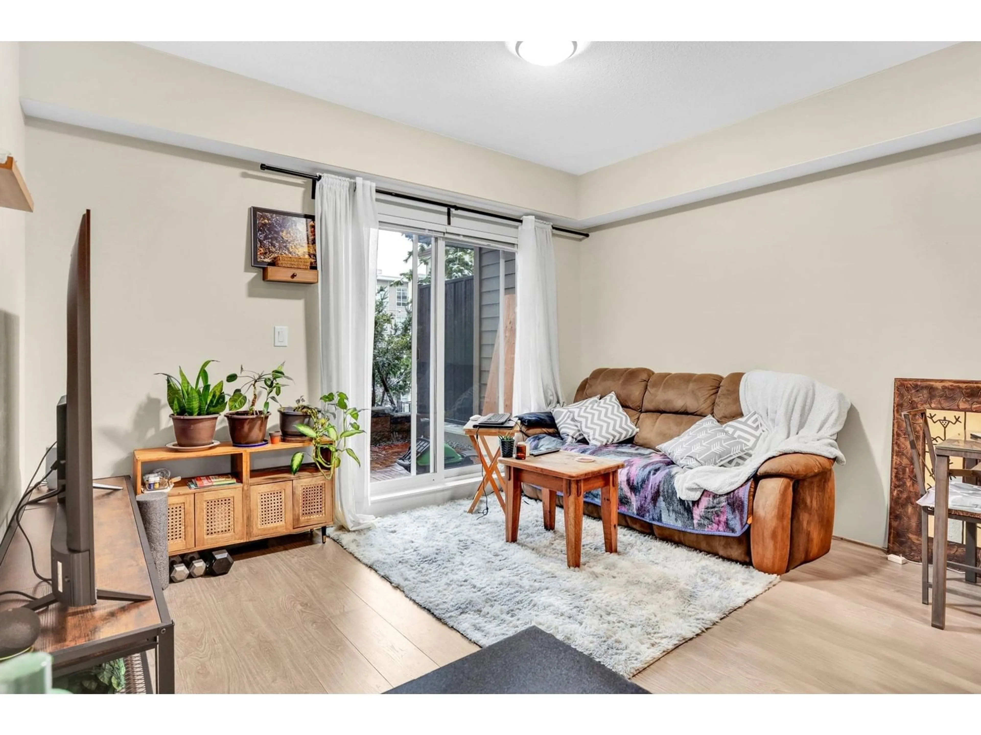 Living room with furniture, wood/laminate floor for 212 - 13768 108, Surrey British Columbia V3T0L9