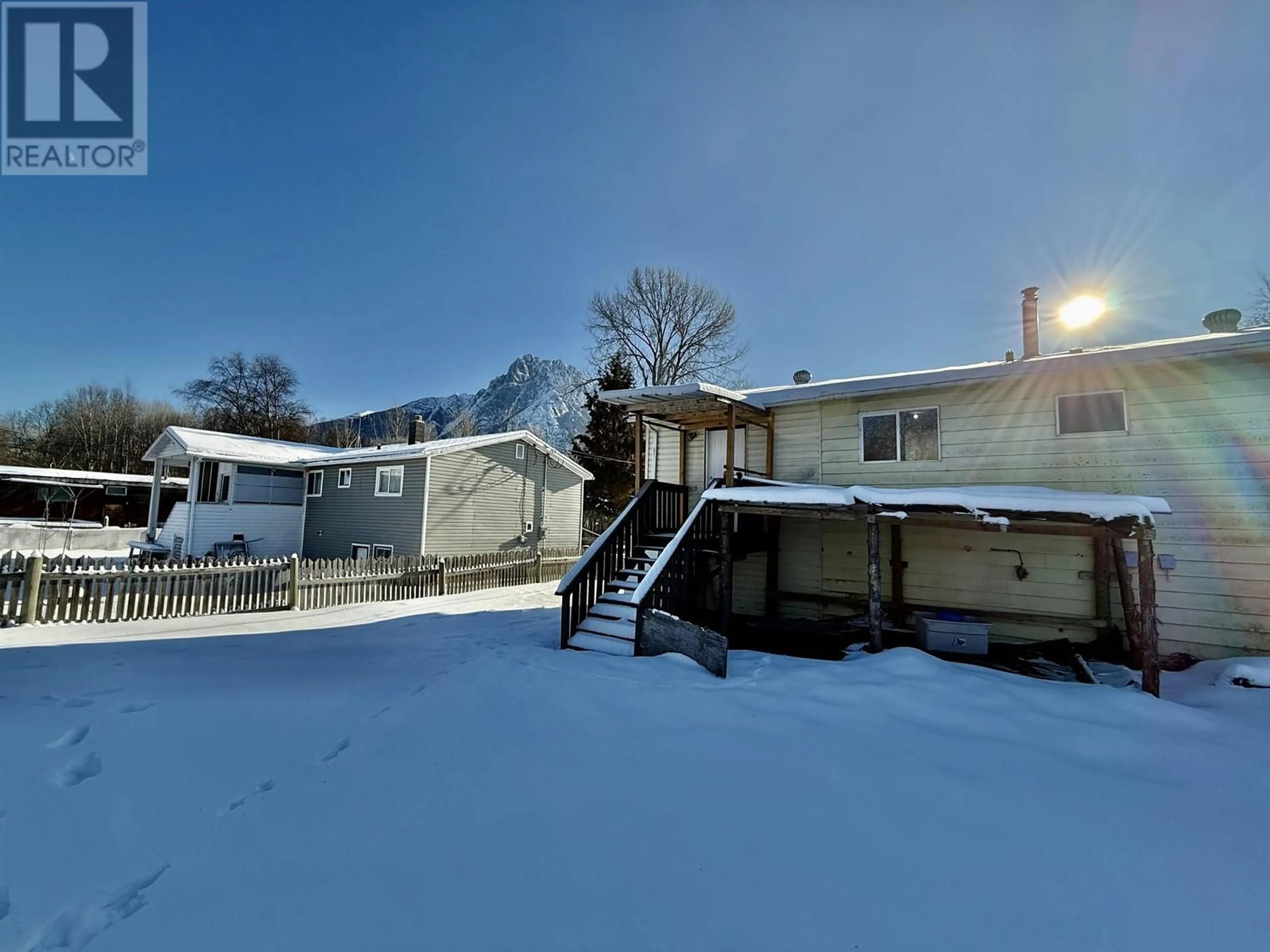 A pic from outside/outdoor area/front of a property/back of a property/a pic from drone, mountain view for 2131 24TH AVENUE, Hazelton British Columbia V0J2J1