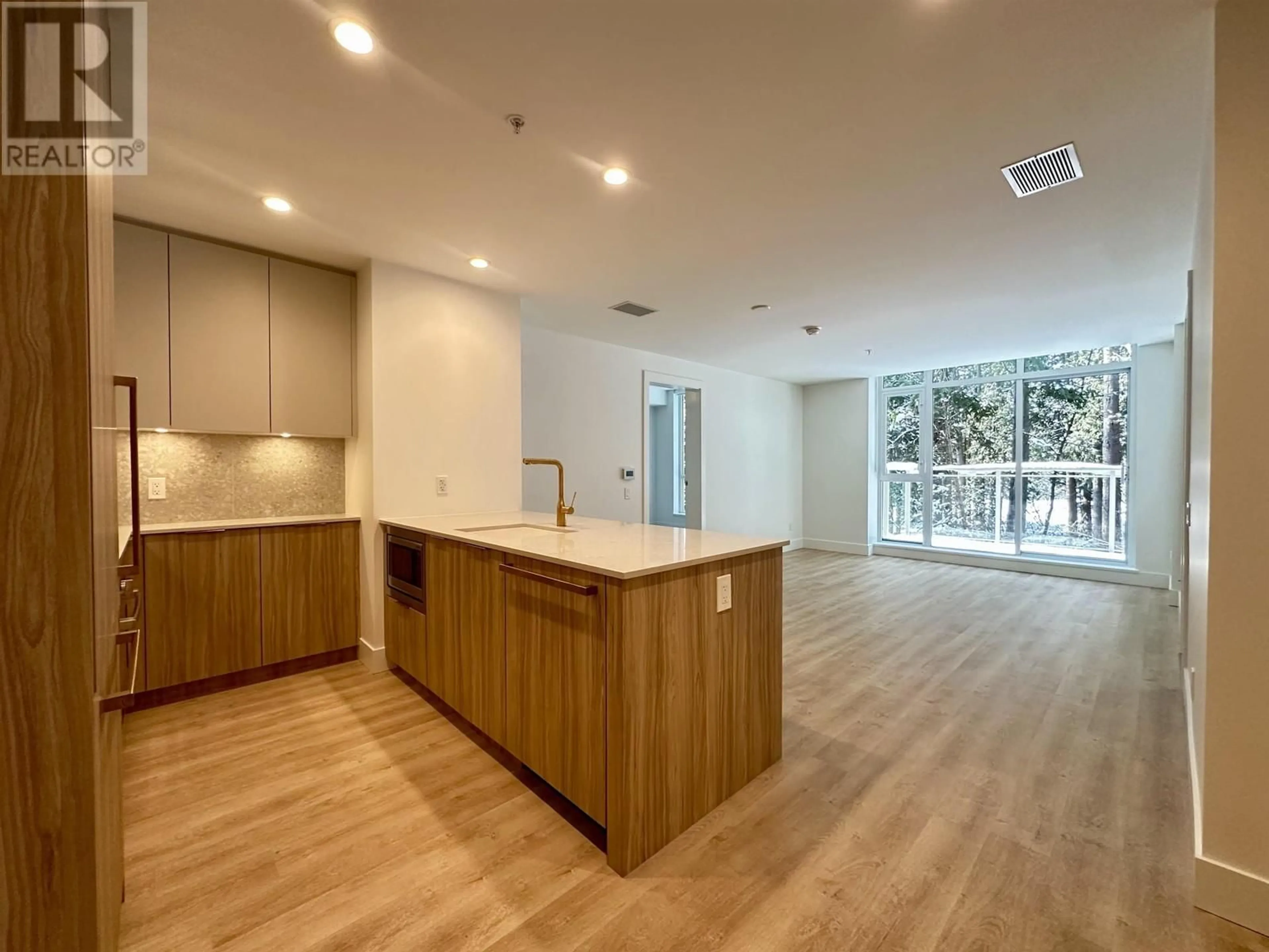 Open concept kitchen, wood/laminate floor for 401 2325 EMERY COURT, North Vancouver British Columbia V7J0E3