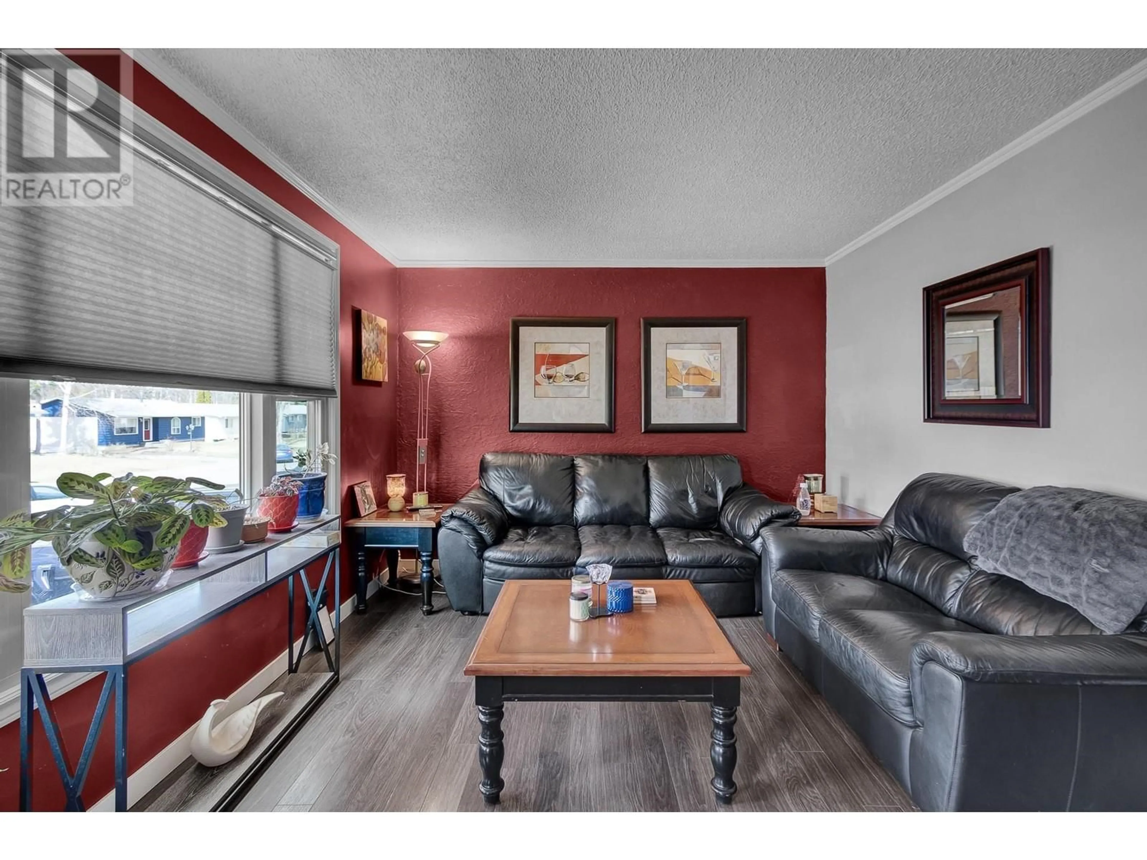 Living room with furniture, wood/laminate floor for 7670 LOYOLA DRIVE, Prince George British Columbia V2N2X1