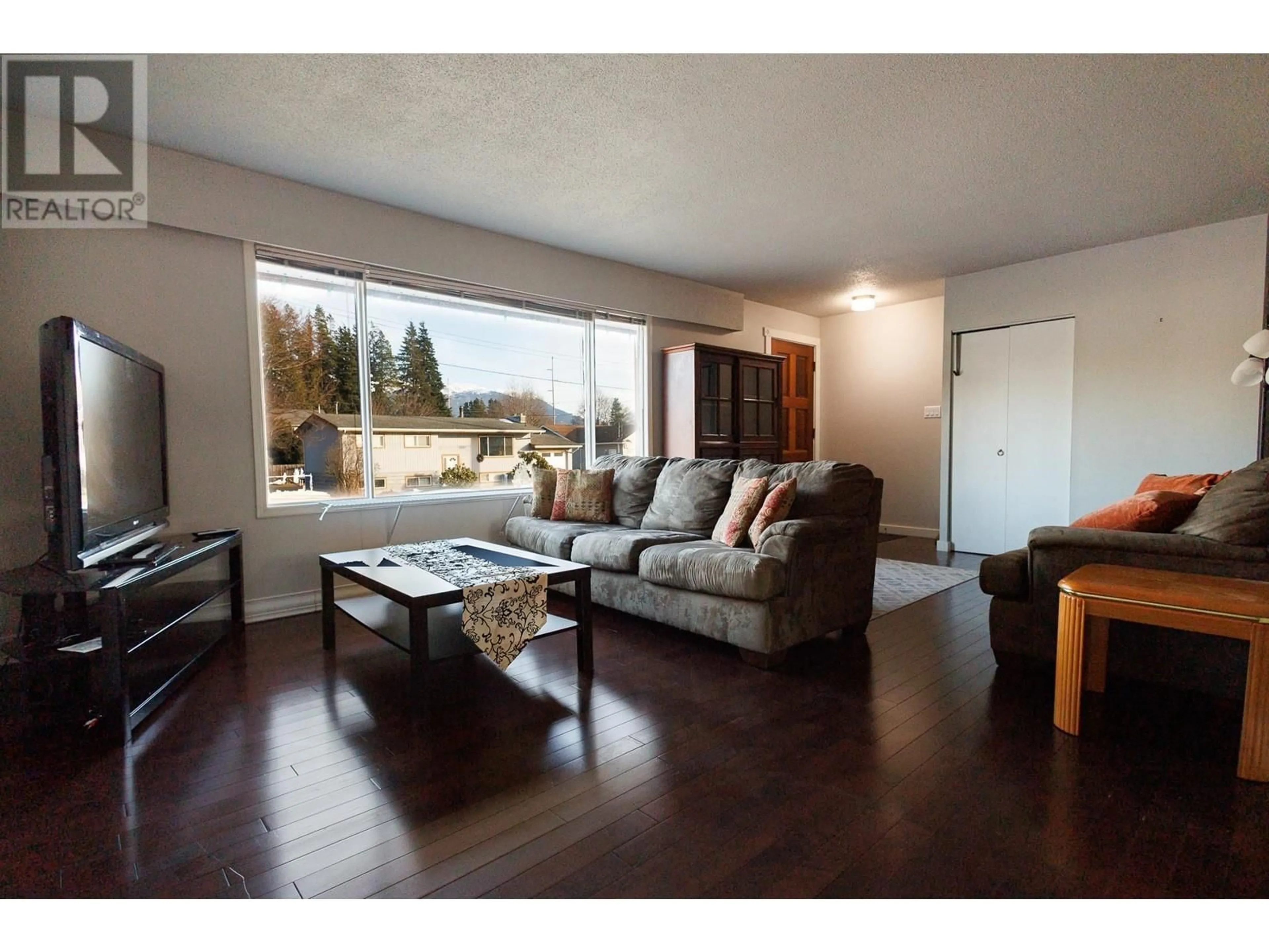 Living room with furniture, wood/laminate floor for 3313 PHEASANT STREET, Terrace British Columbia V8G3H4