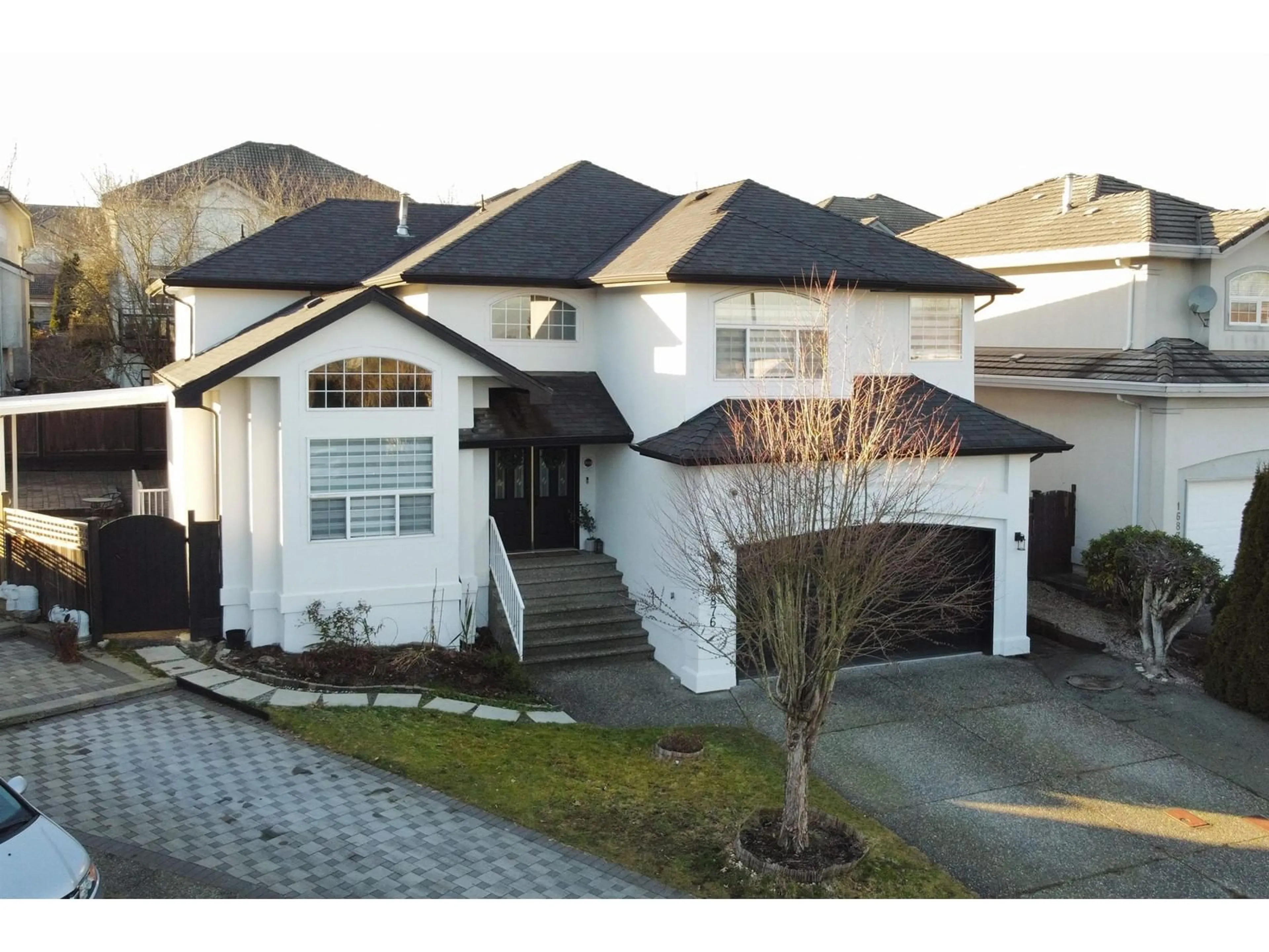 Home with vinyl exterior material, street for 16876 83 AVENUE, Surrey British Columbia V4N4V1